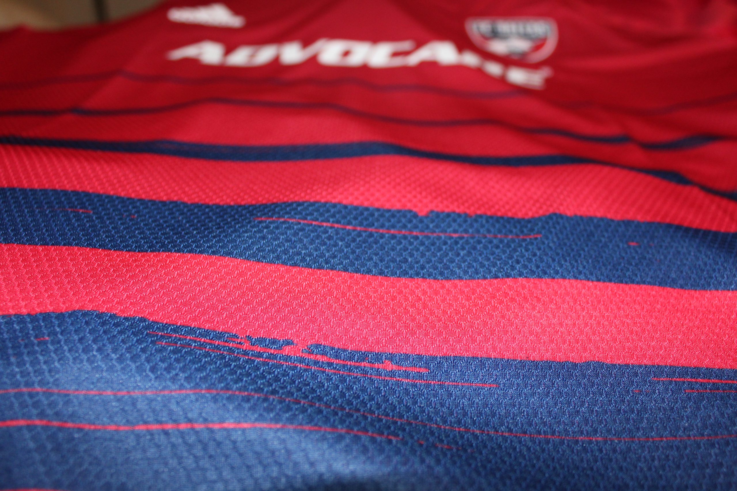 adidas' brushstroke theme for 2020 on display in the blue hoops on the 2020 FC Dallas home jersey (Dan Crooke)