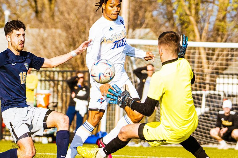 Malik Henry-Scott scores for the Tulsa Hurricanes in 2022.