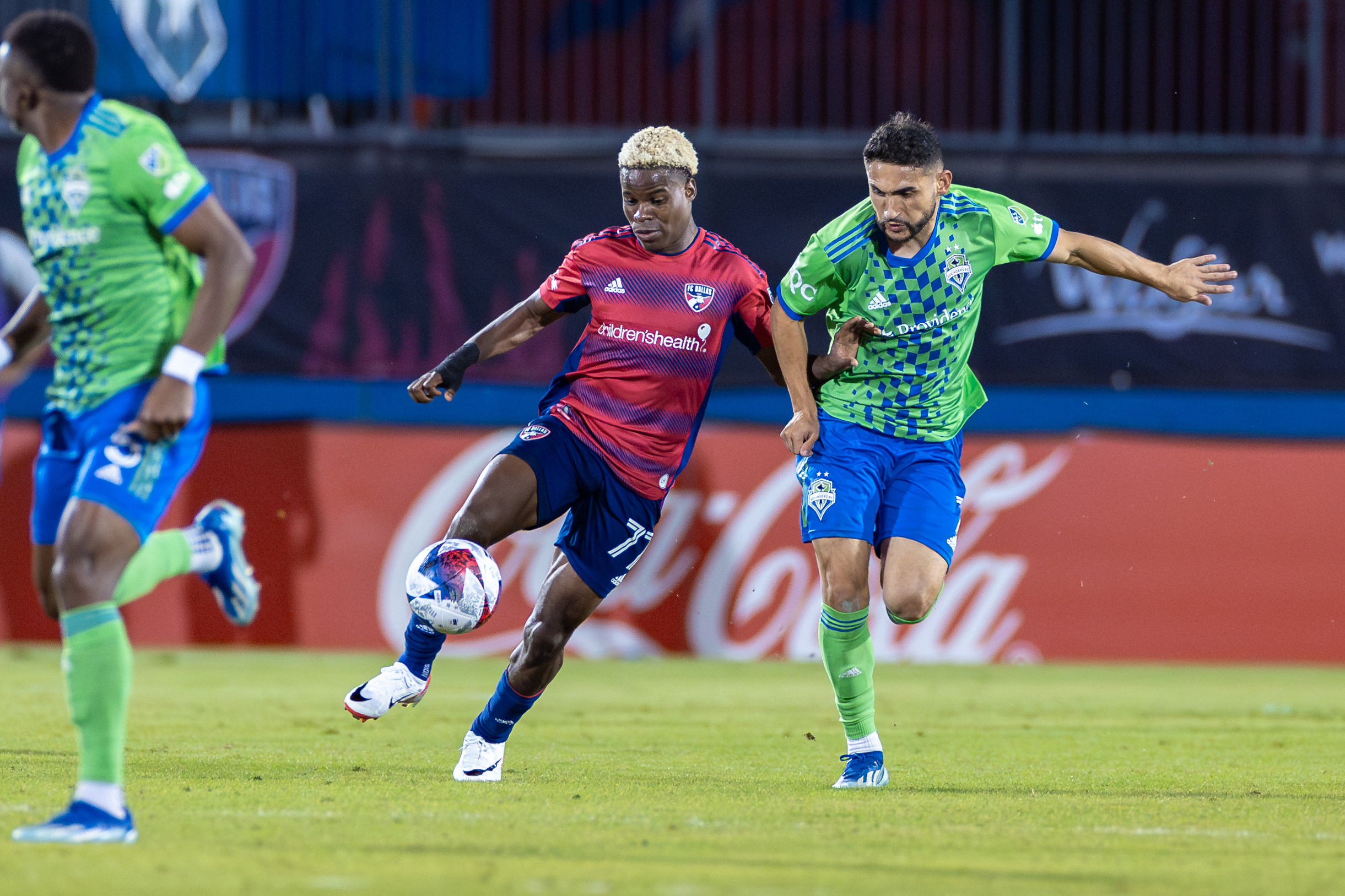Bernard Kamungo shields the ball against Seattle Sounders during the 2023 MLS Cup Playoffs First Round, Game Two, at Toyota Stadium, November 4, 2023. (Matt Visinsky, 3rd Degree)