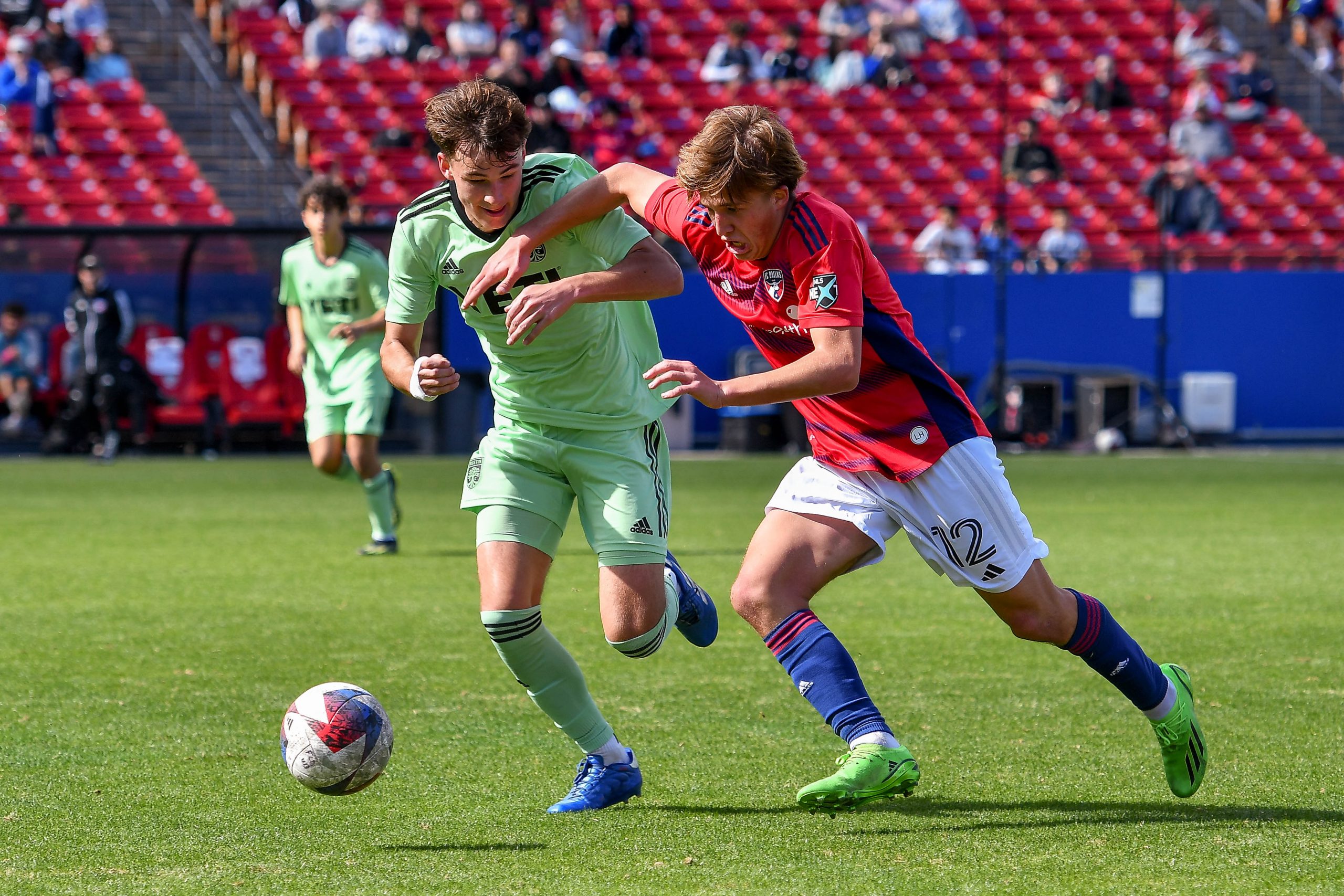 FC Dallas U17 midfielder Caleb Swann (12) fights for possession in the MLS Next match against Austin FC at Toyota Stadium on Sunday, February 4, 2024. (Daniel McCullough / 3rd Degree)