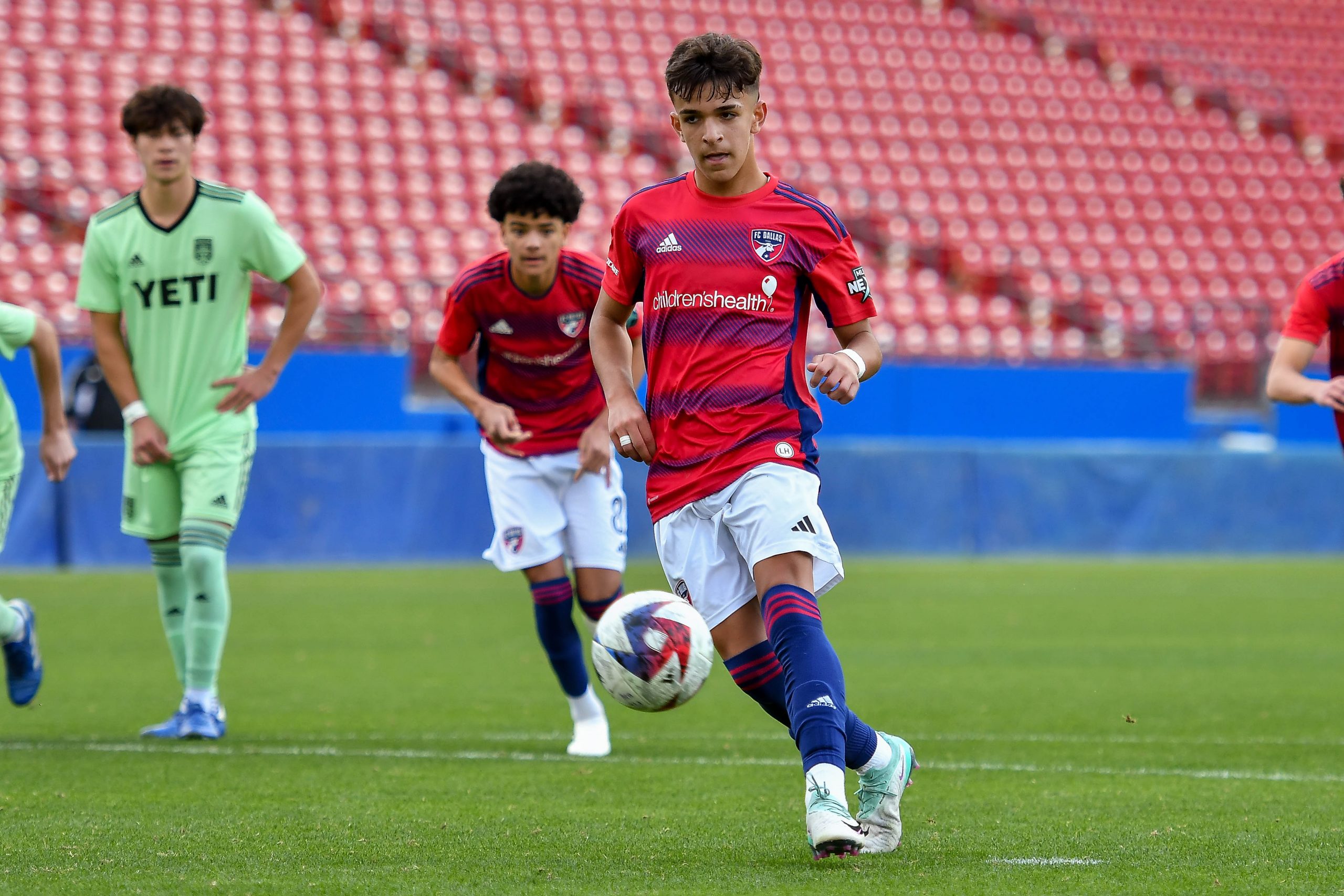 FC Dallas U17 midfielder Gabriel Mendonca (13) scores the penalty kick in the MLS Next match against Austin FC at Toyota Stadium on Sunday, February 4, 2024. (Daniel McCullough / 3rd Degree)
