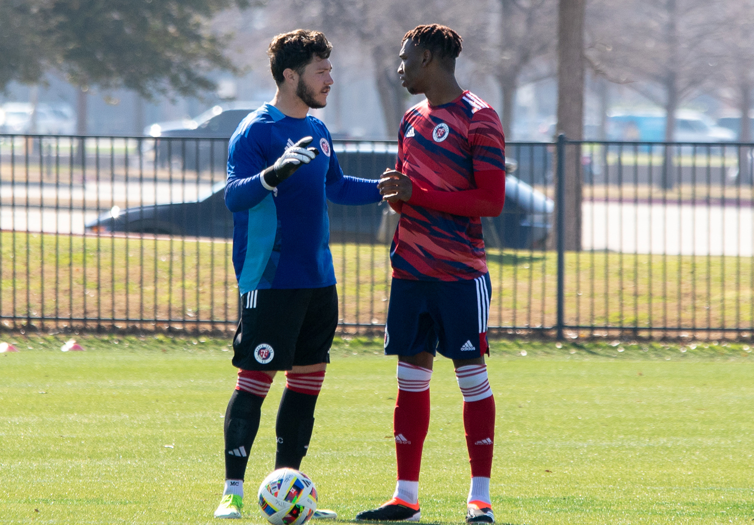 Keeper Michael Collodi chats with his center back Nico Gordon prior to taking on Houston Dynamo 2, February 21, 2024. (Brooke Humphrey, 3rd Degree)