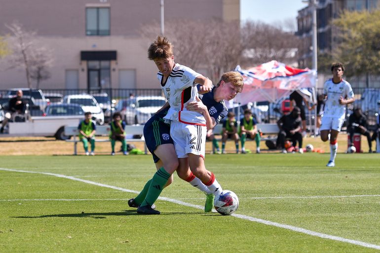 FC Dallas U17 midfielder Caleb Swann (12) is tackled in the MLS Next match against Dallas Hornets on Saturday, March 2, 2024 at Toyota Soccer Center. (Daniel McCullough, 3rd Degree)