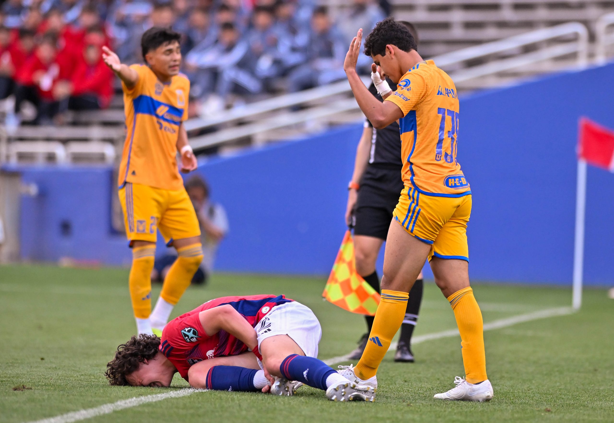 FC Dallas U19 defender Cristian Gallo is tackled near the sideline in the Dallas Cup match against Tigers UANL at the Cotton Bowl on Sunday, March 24,2024. (Daniel McCullough, 3rd Degree)