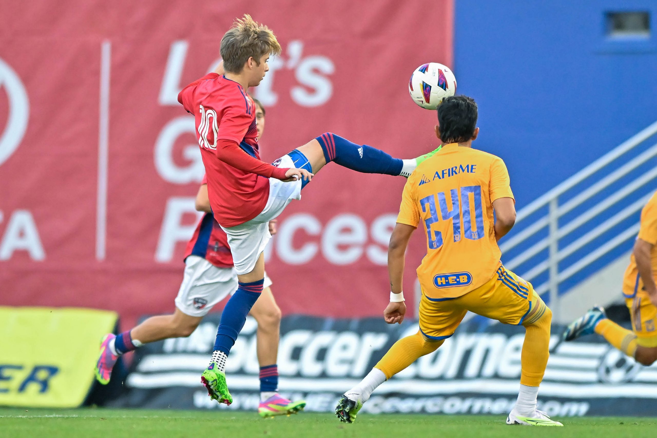 FC Dallas U19 midfielder Dylan Lacy jumps to receive the ball in the Dallas Cup match against Tigers UANL at the Cotton Bowl on Sunday, March 24,2024. (Daniel McCullough, 3rd Degree)