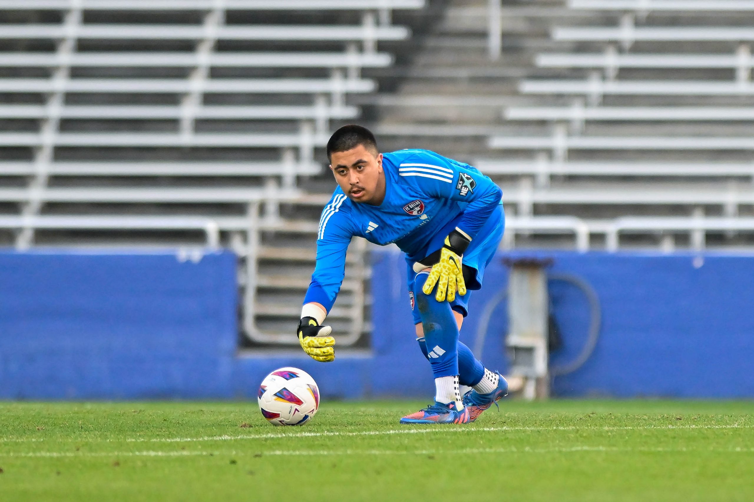 FC Dallas U19 goalkeeper Victor Gomez rolls the ball out to his defender in the Dallas Cup match against Tigers UANL at the Cotton Bowl on Sunday, March 24,2024. (Daniel McCullough, 3rd Degree)