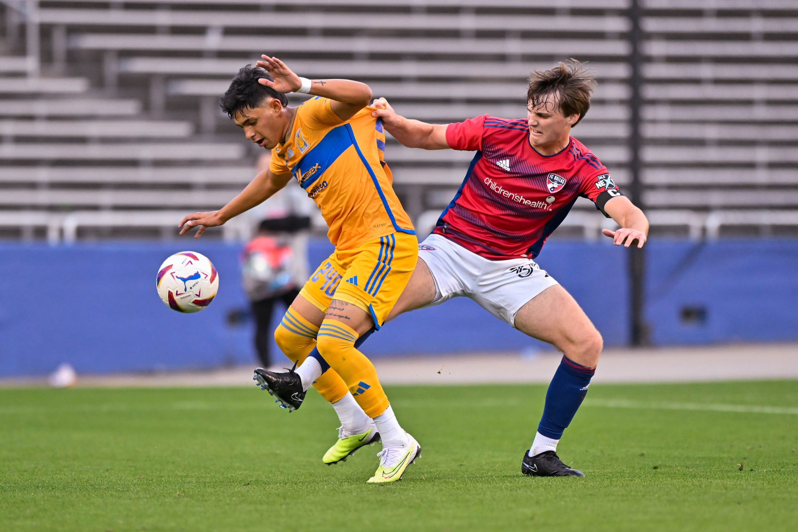 FC Dallas U19 defender Luke Shreiner attempts to poke the ball loose in the Dallas Cup match against Tigers UANL at the Cotton Bowl on Sunday, March 24,2024. (Daniel McCullough, 3rd Degree)