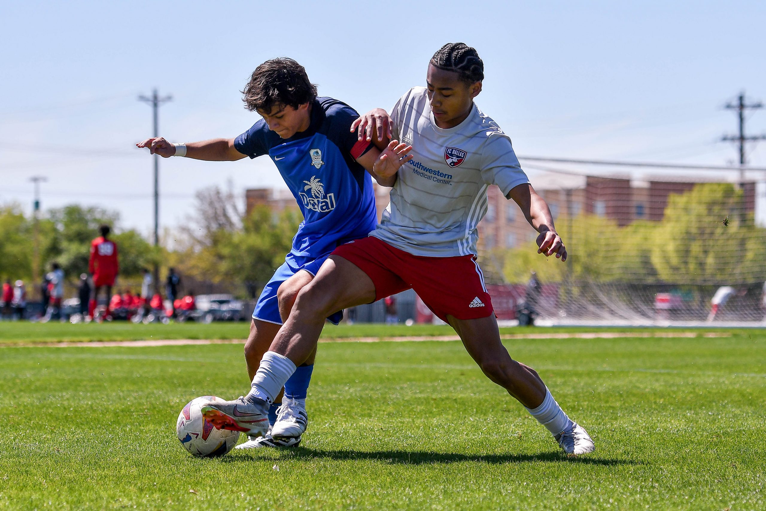 FC Dallas U17 ECNL White forward Quincy Carter pressure the defender in the Dallas Cup match against Doral SC at Toyota Soccer Center on March 26, 2024. (Daniel McCullough, 3rd Degree)