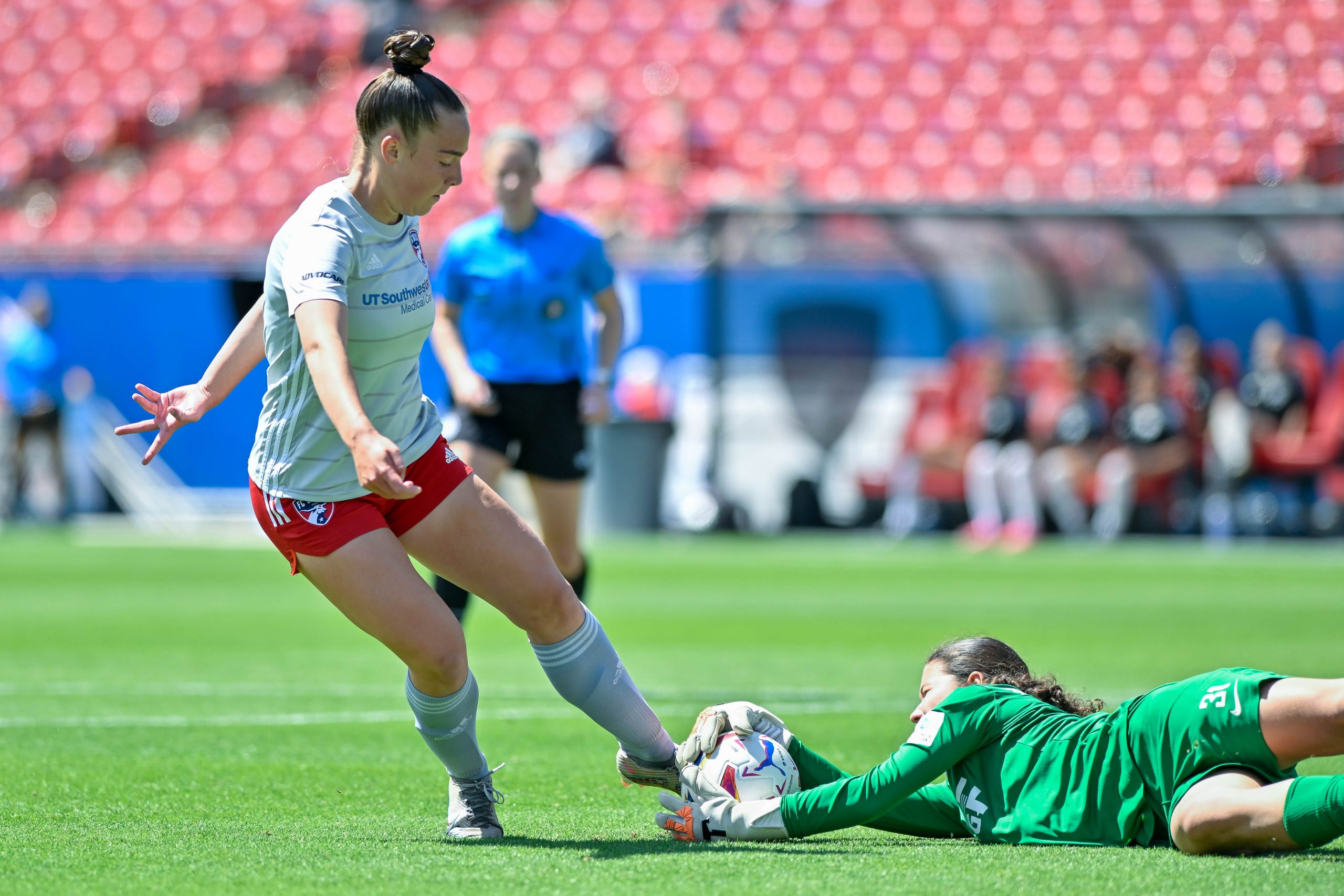 FC Dallas ECNL midfielder Rylee Mclanahan kicks at the ball as it’s saved in the Dallas Cup U17 Final against Eintracht Frankfurt at Toyota Stadium on Saturday, March 29, 2024. (Daniel McCullough, 3rd Degree)