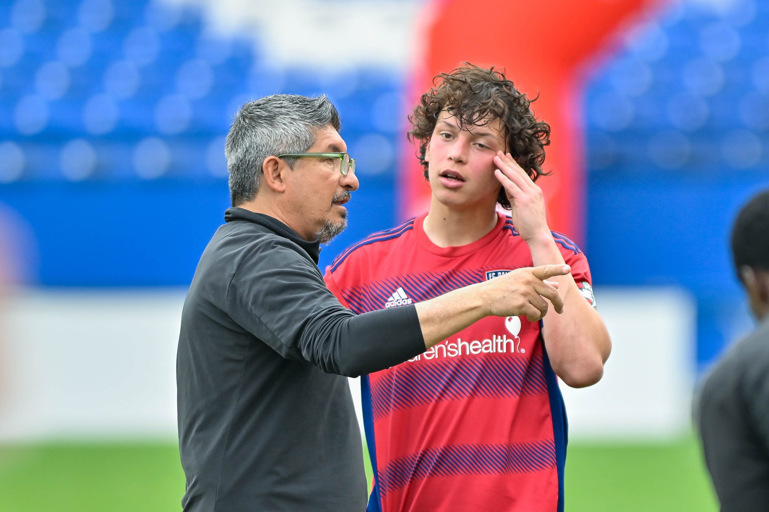 FC Dallas coach Victor Medina talks to defender Cristian Gallo during halftime of the Dallas Cup Super Group Final against São Paulo FC at Toyota Stadium on Sunday, March 31, 2024. (Daniel McCullough, 3rd Degree)