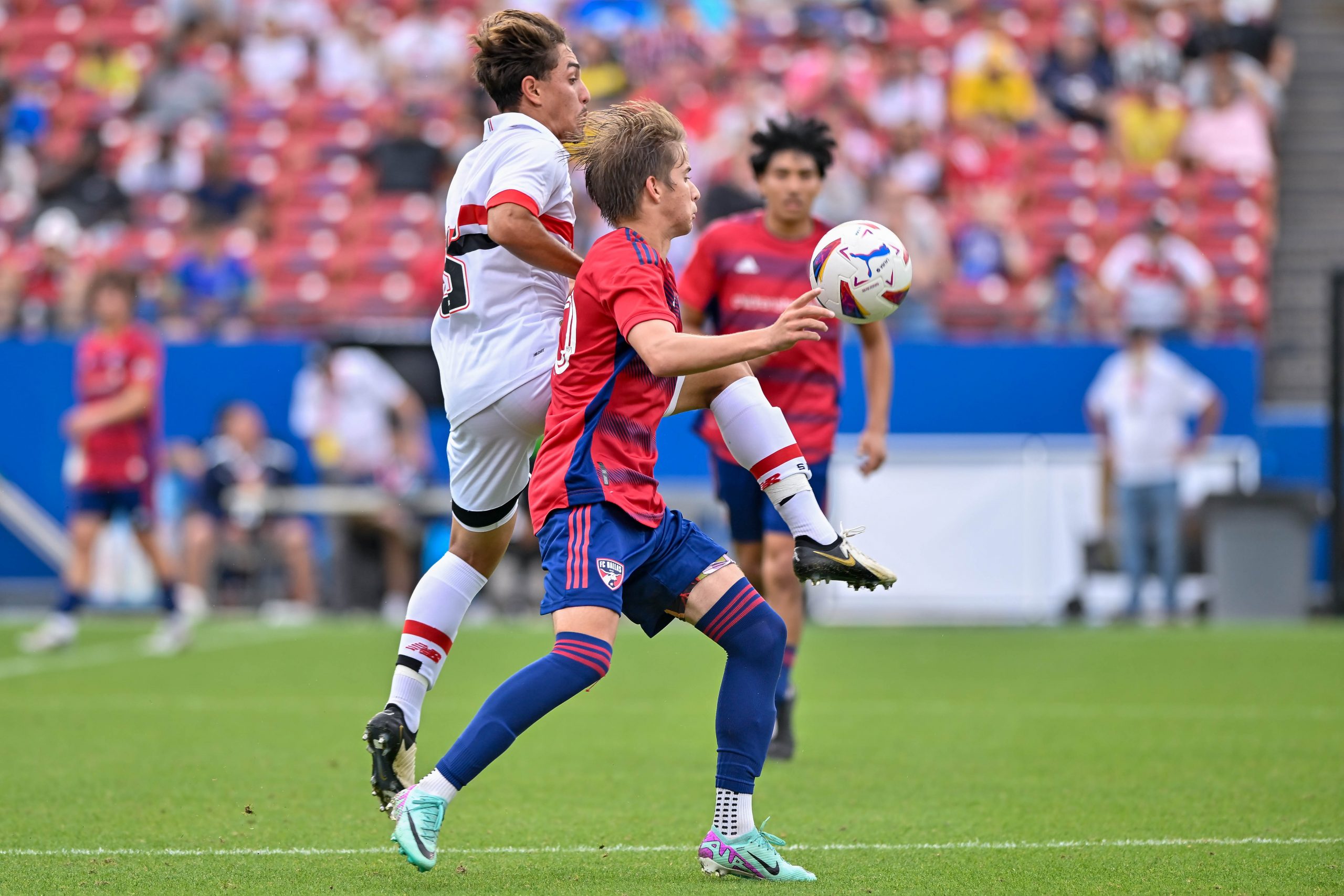 FC Dallas midfielder Dylan Lacy receives the ball under pressure in the Dallas Cup Super Group Final against São Paulo FC at Toyota Stadium on Sunday, March 31, 2024. (Daniel McCullough, 3rd Degree)