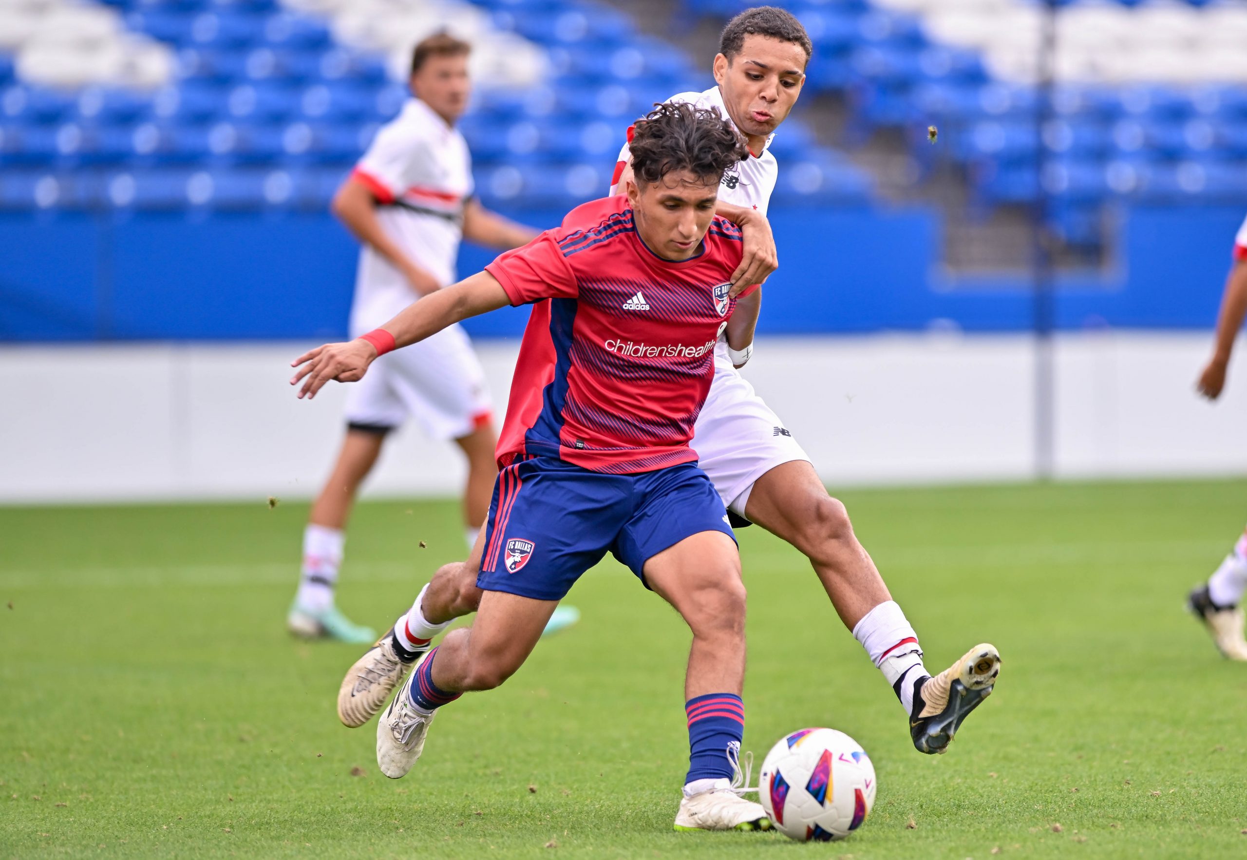 FC Dallas U19 midfielder Jared Salazar blocks the opposing player in the Dallas Cup Super Group Final against São Paulo FC at Toyota Stadium on Sunday, March 31, 2024. (Daniel McCullough, 3rd Degree)