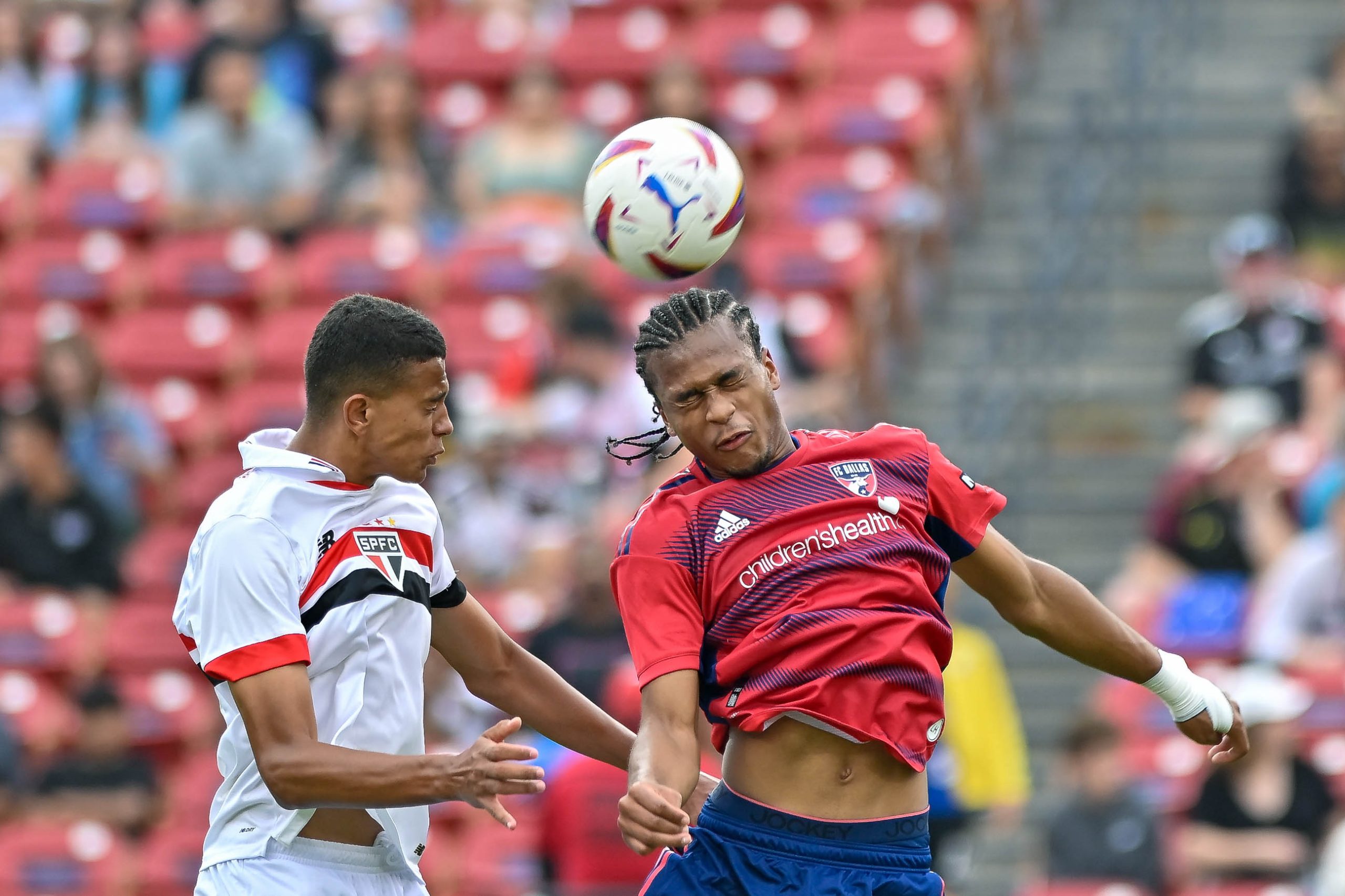 FC Dallas U19 midfielder Ishmael Nieves wins the header in the Dallas Cup Super Group Final against São Paulo FC at Toyota Stadium on Sunday, March 31, 2024. (Daniel McCullough, 3rd Degree)