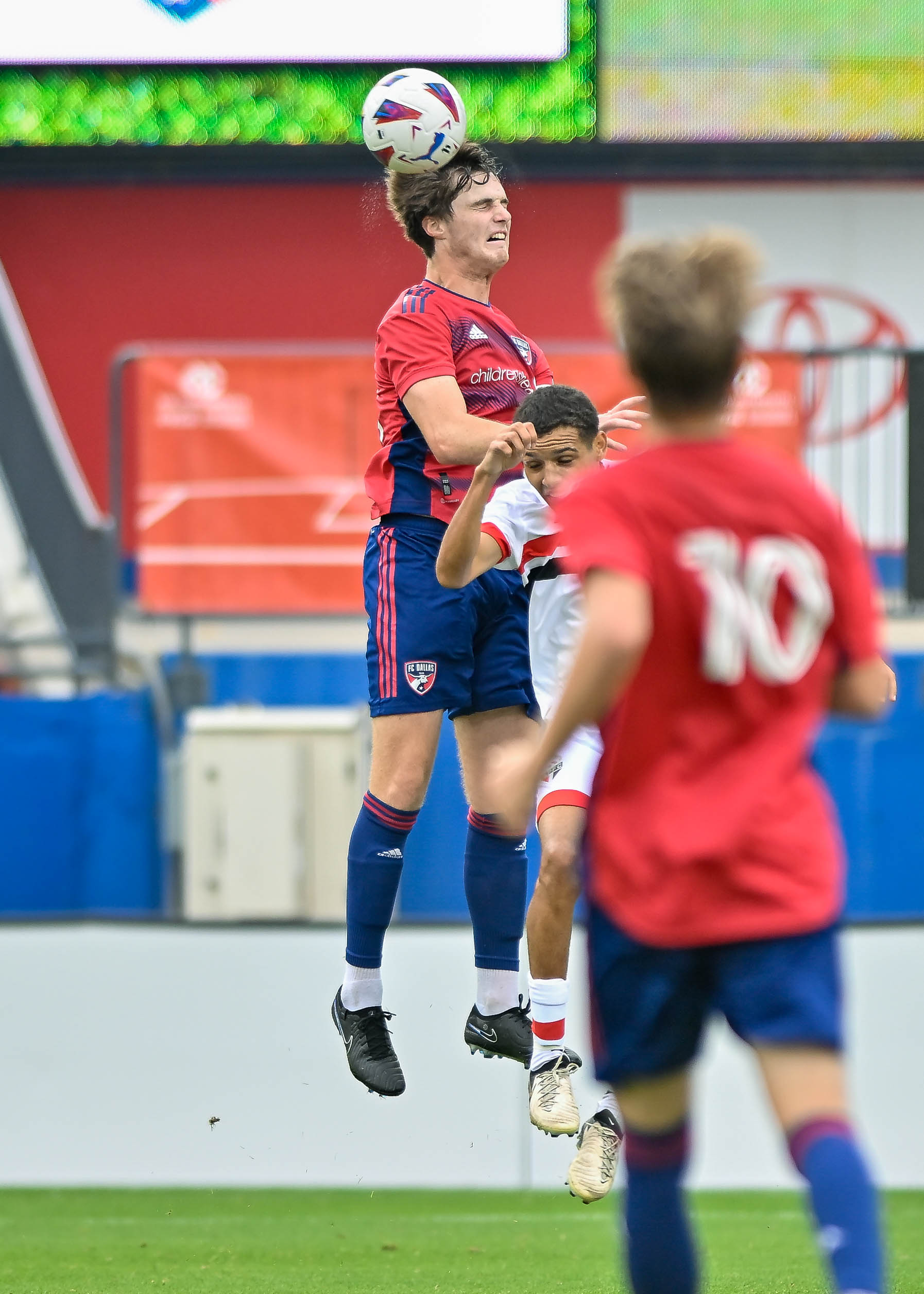 FC Dallas U19 defender Luke Shreiner heads the ball in the Dallas Cup Super Group Final against São Paulo FC at Toyota Stadium on Sunday, March 31, 2024. (Daniel McCullough, 3rd Degree)