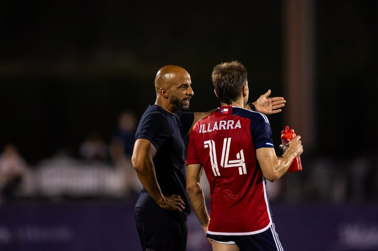 Interim Coach Peter Luccin, coaching his first game, chats with Spanish veteran Asier Illarramendi, June 15, 2024. (Courtesy FC Dallas)