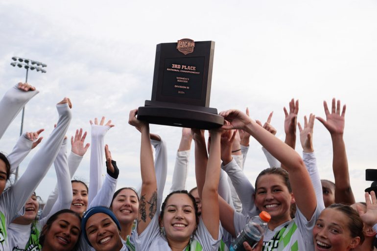 Brookhaven lifts the 3rd place trophy at the NJCAA D3 Championships, November 15, 2024. (Courtesy Dallas Brookhaven)