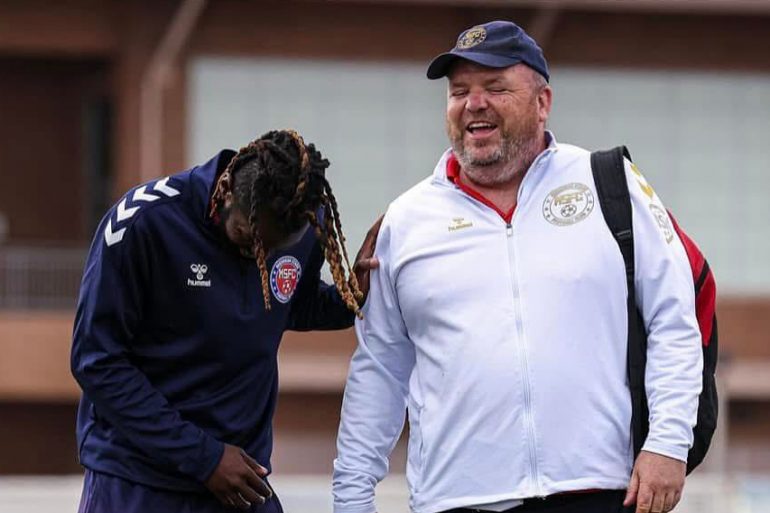 Stewart Flaherty (right) enjoys a moment with one of his players (Remy Tazifor) while head coach of Michigan Stars, 2024. (Courtesy Stewart Flaherty)