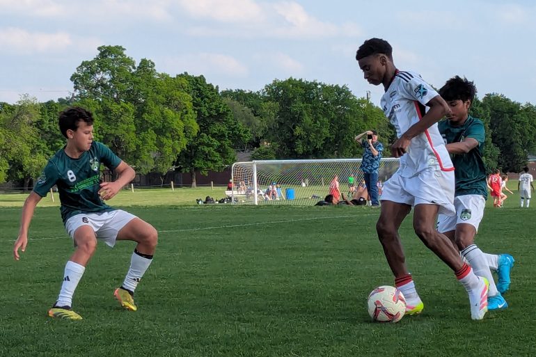 Neil Akem takes on two Houston Select defenders, April 16, 2025. (Buzz Carrick, 3rd Degree)