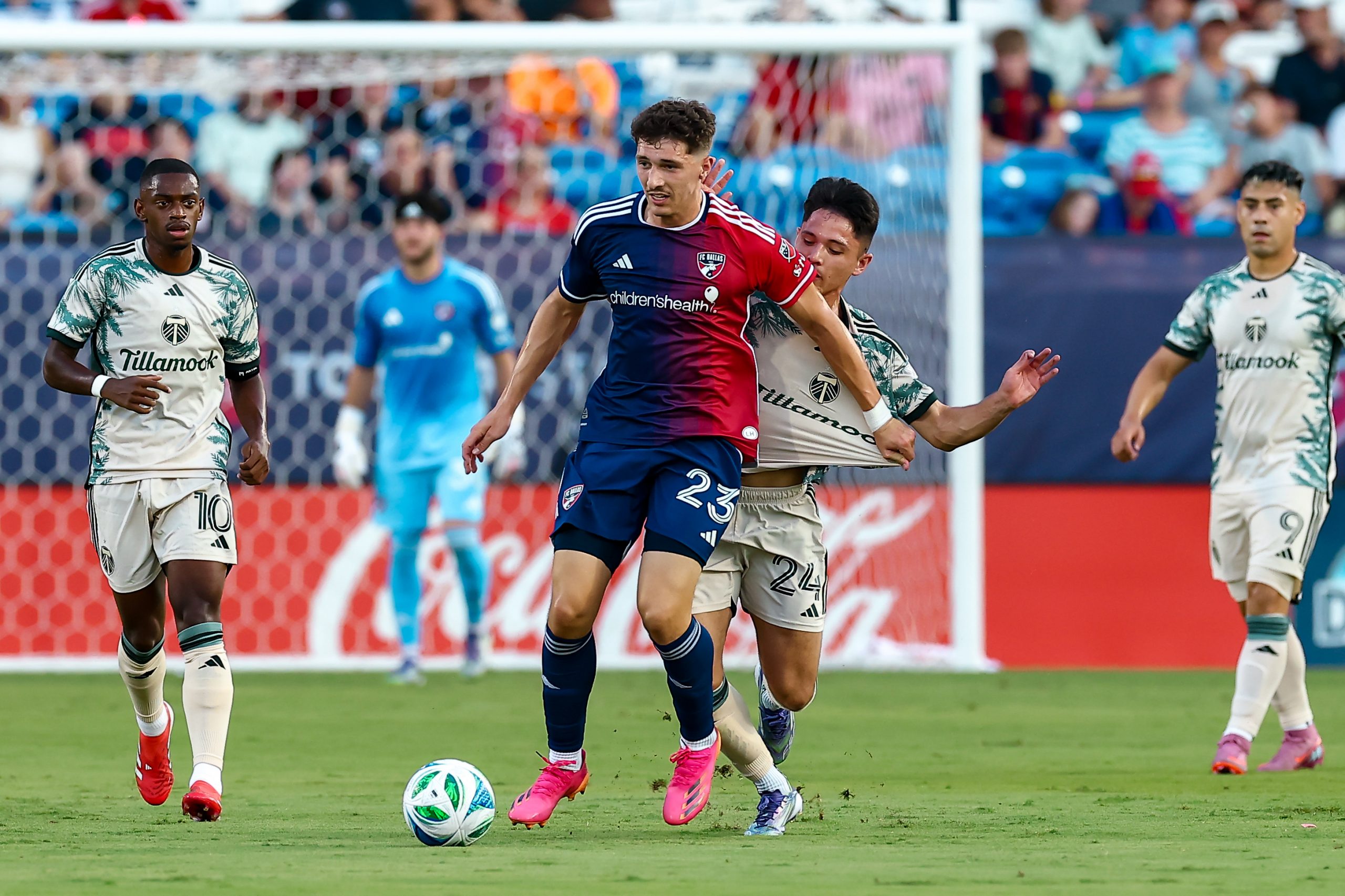 Logan Farrington holds off a defender against Portland Timbers, August 9, 2025. (Matt Visinsky, 3rd Degree)