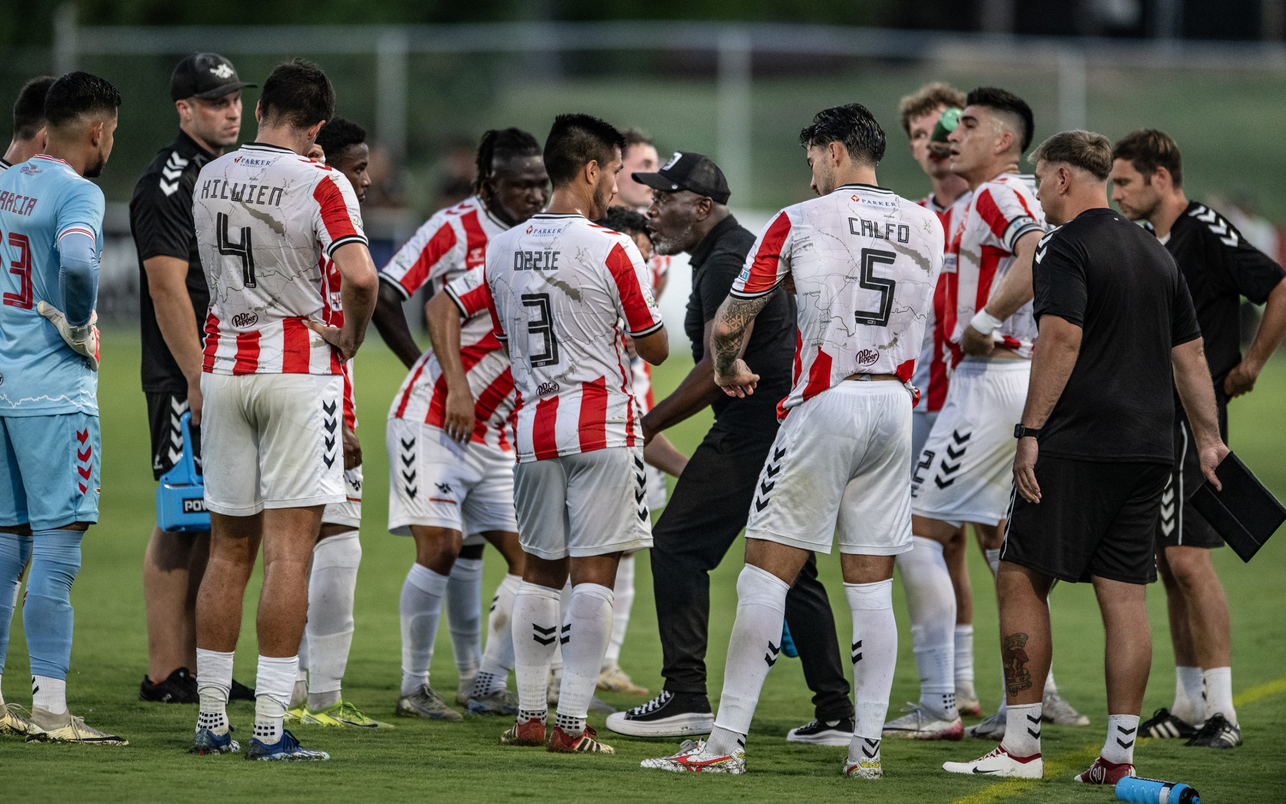 Coach Adrian Forbes give his team a talking to during a break as Texoma FC takes Chattanooga Red Wolves, August 16, 2025. (Mike Brooks, 3rd Degree)