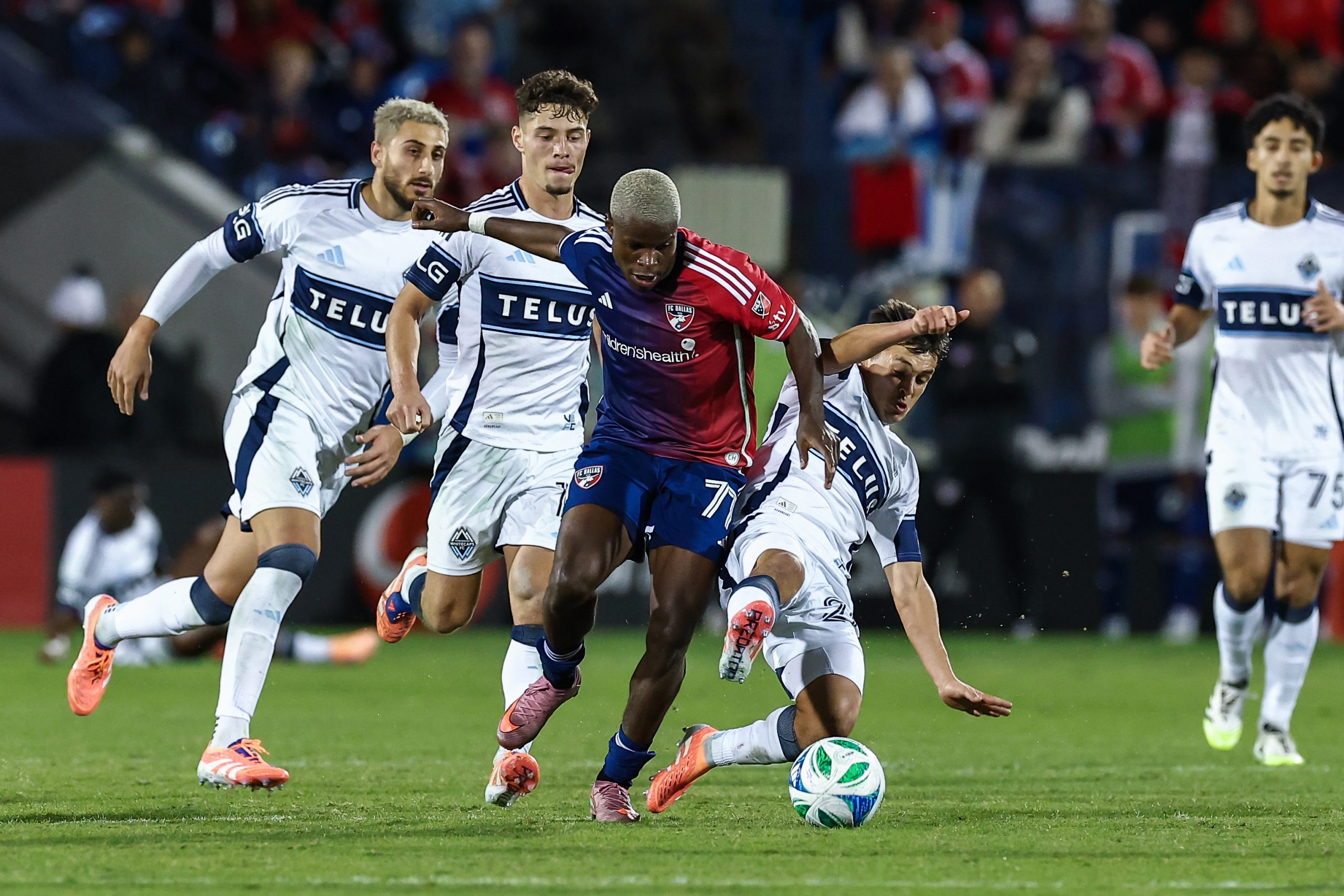 Bernie Kamungo breaks through the Vancouver Whitecaps defense in the MLS Cup Playoff game 2, November 1, 2025. (Matt Visinsky, 3rd Degree)