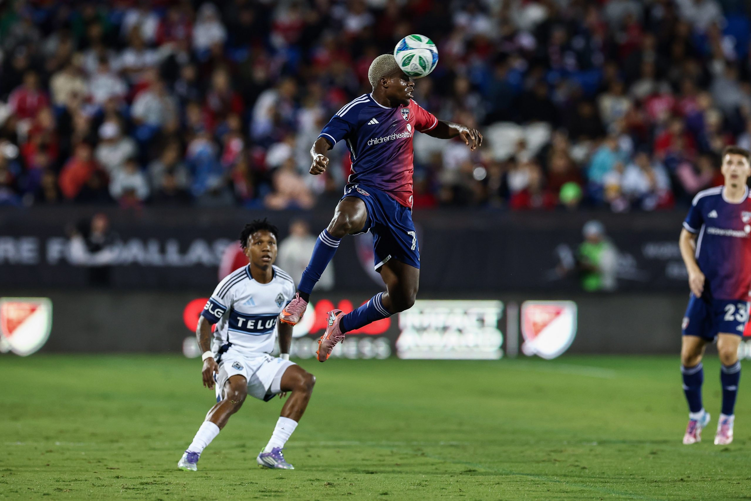 Bernie Kamungo goes up for a header and pays the price against the Vancouver Whitecaps in the MLS Cup Playoff game 2, November 1, 2025. (Matt Visinsky, 3rd Degree)