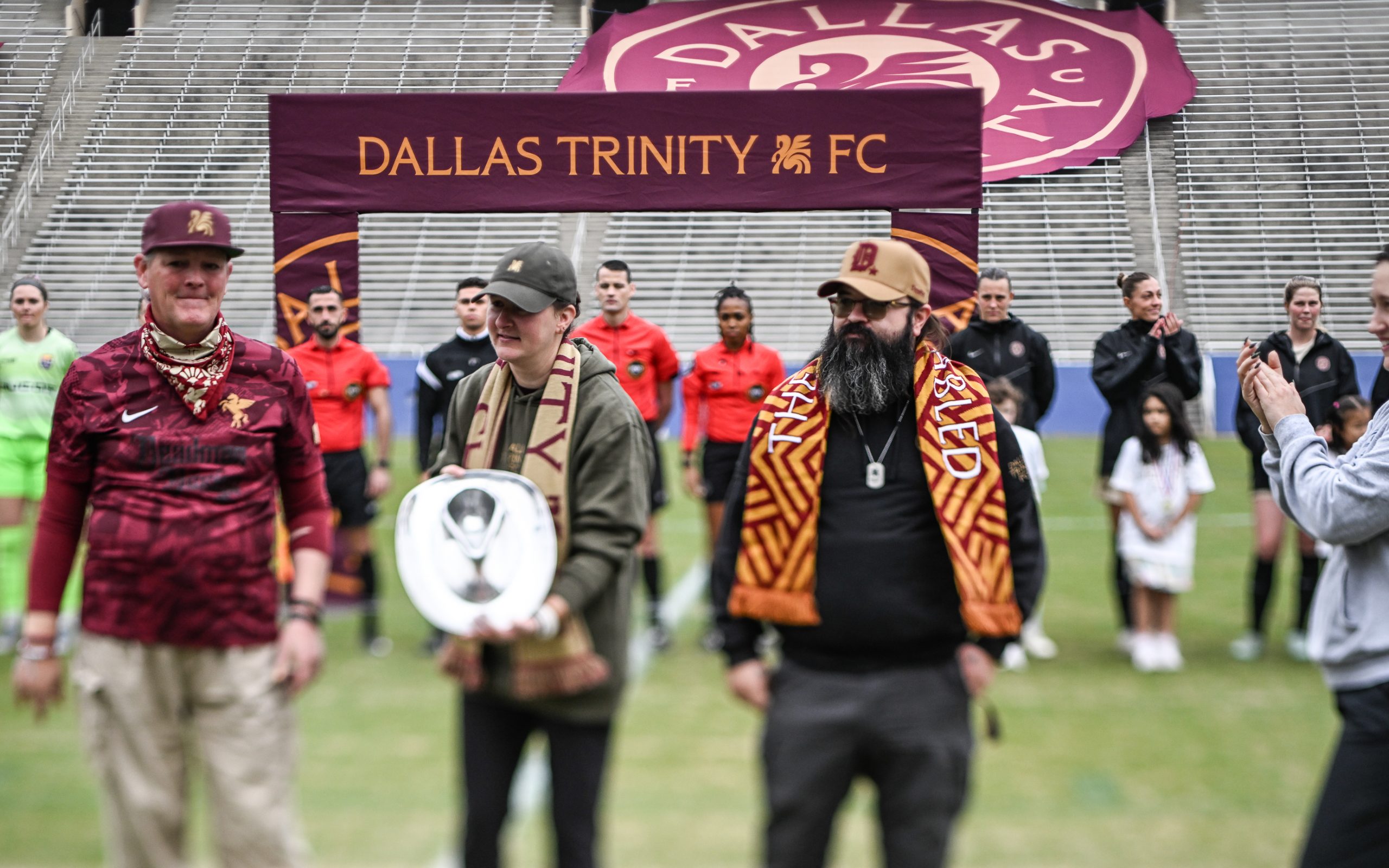 Supporters deliver the "Copa Tejas Shield" - awarded for the best professional soccer record in Texas over the previous year - to winner Dallas Trinity prior to the 1-0 Dallas Trinity win over Carolina Ascent, December 13, 2025. (Mike Brooks, 3rd Degree)