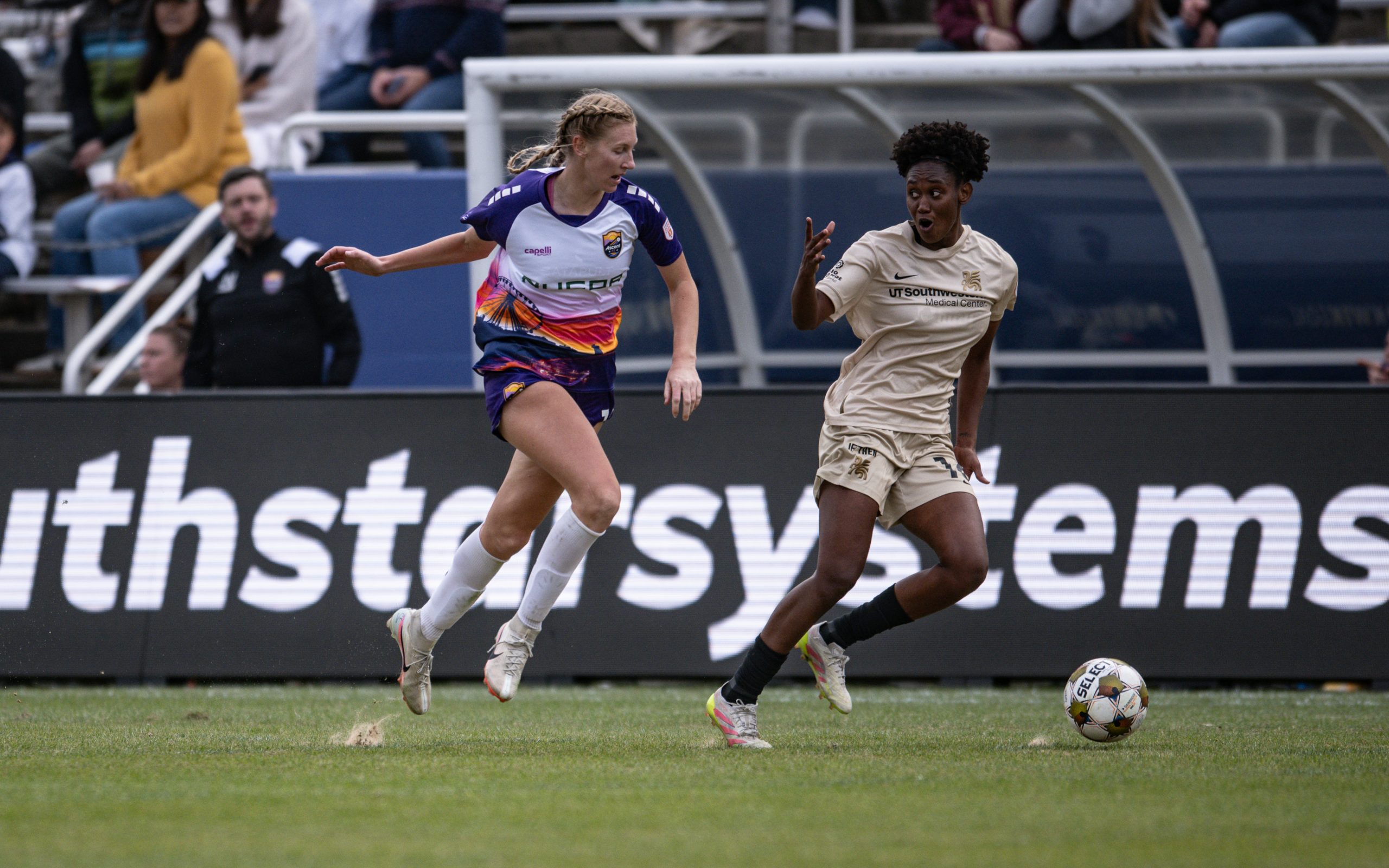 Tamara Bolt says "you can't catch me" to a defender in the 1-0 Dallas Trinity win over Carolina Ascent, December 13, 2025. (Mike Brooks, 3rd Degree)