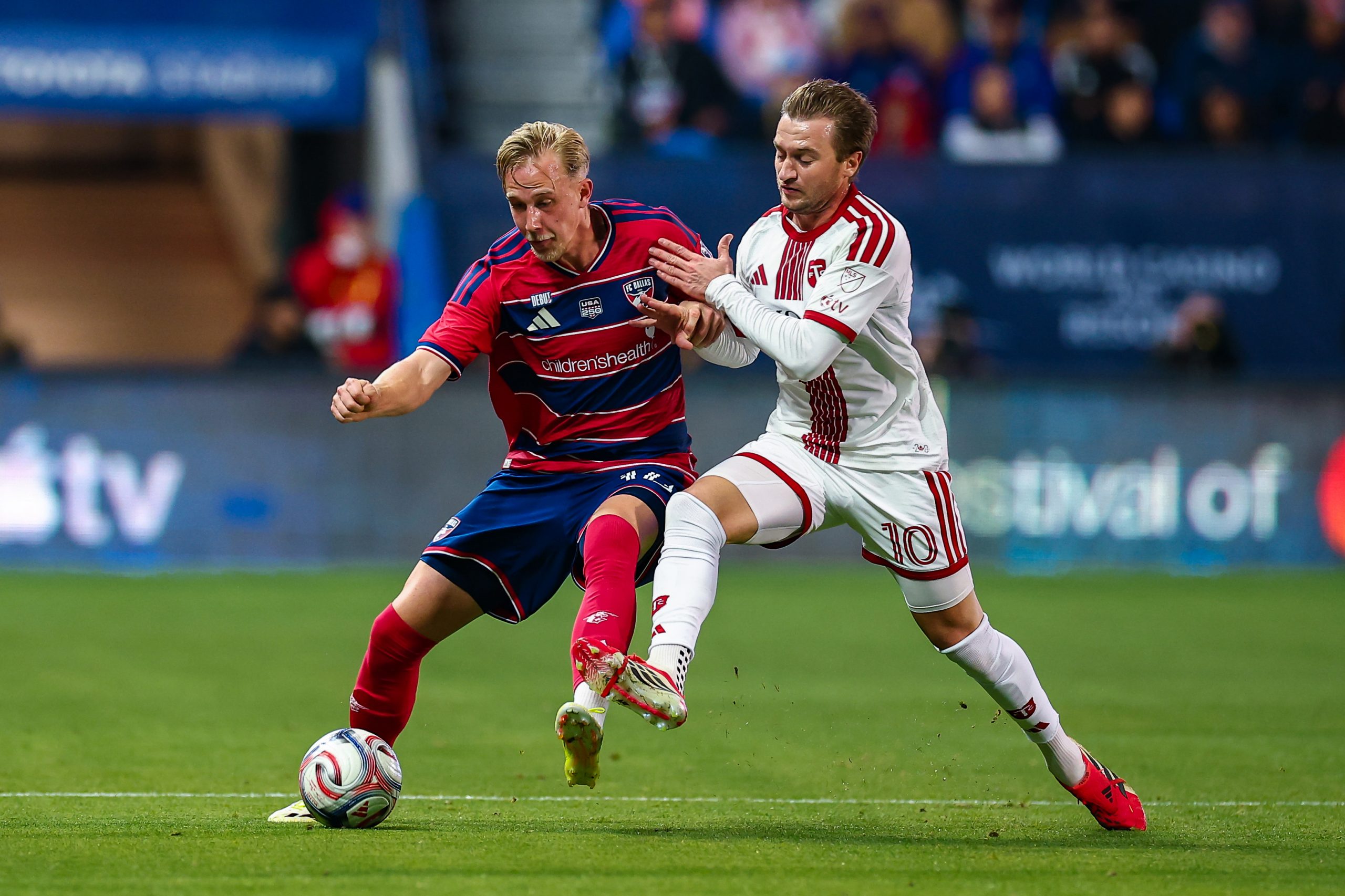 Herman Johansson holds off a defender against Toronto FC, February 21, 2026. (Matthew Visinsky, 3rd Degree)