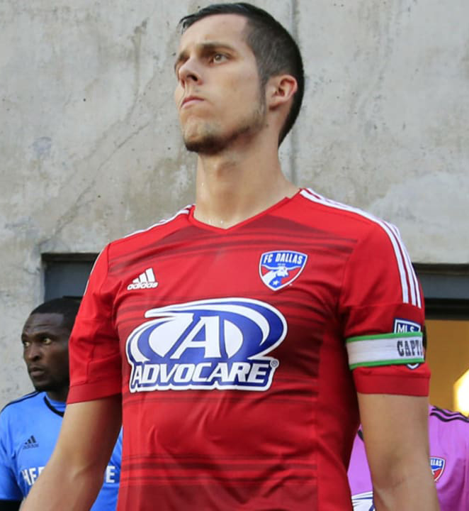 Matt Hedges leads FC Dallas out on to the field against LA Galaxy in 2015 (Major League Soccer)