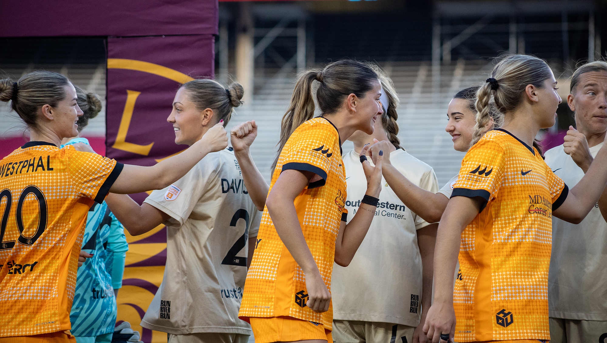 Dallas Trinity and the Houston Dash shake hands prior to facing off on February 28, 2026. (Beth Spicer, 3rd Degree)