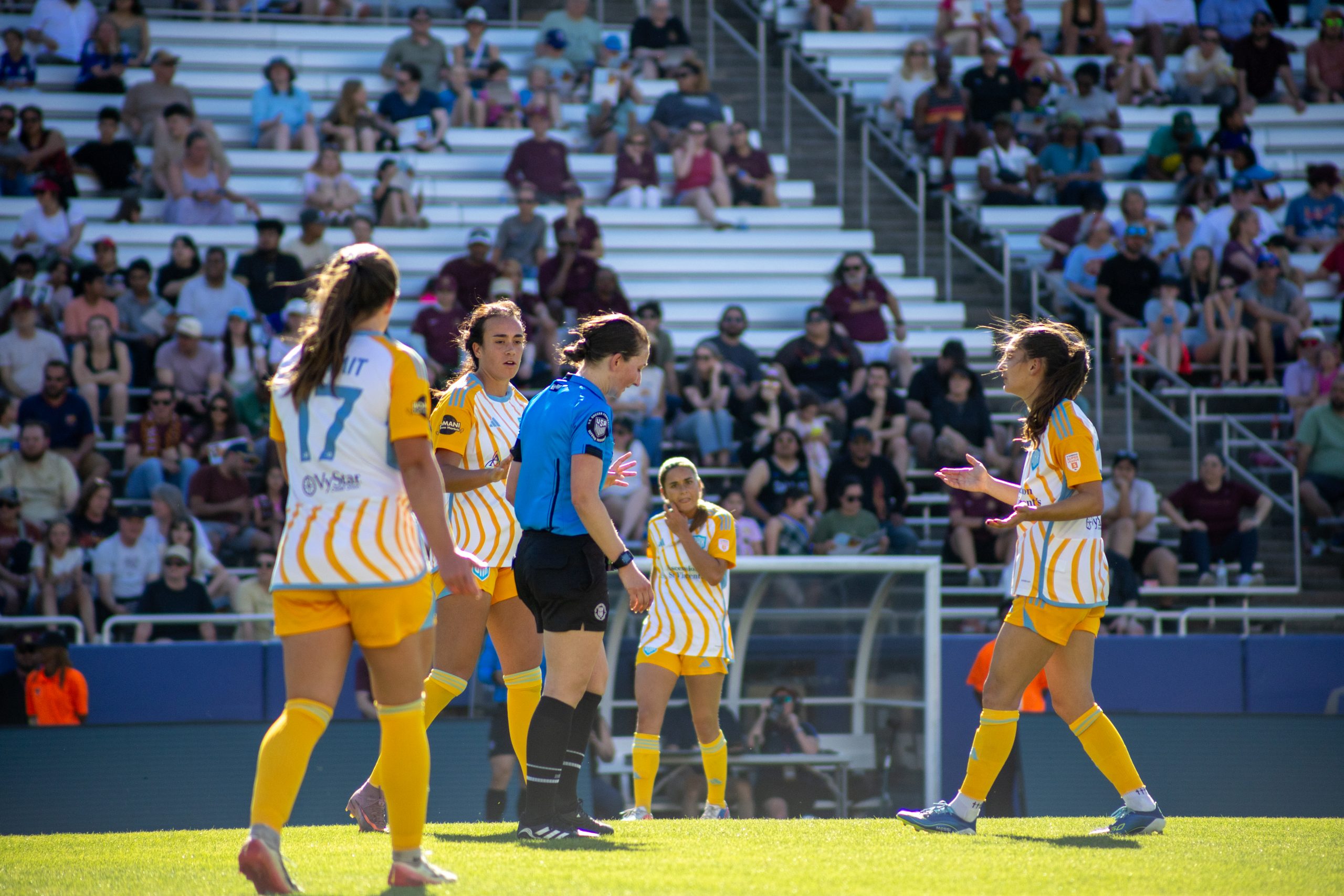 Sporting JAX surrounds the referee in the game against Dallas Trinity, March 22, 2026. (Beth Spicer, 3rd Degree)