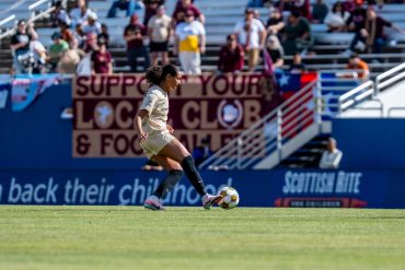Maya McCutcheon touches the ball in front of the home supporters - Carolina Ascent at Dallas Trinity, Apr. 19, 2026 (Anna Dolmany, Dallas Trinity FC)