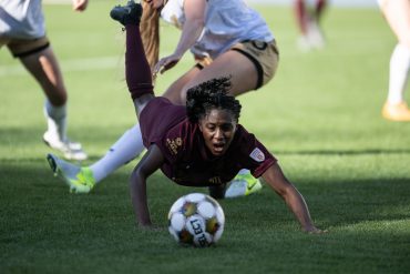 Samar Guidry doves headfirst into the action against Spokane Zephyr, April 4, 2025. (Mike Brooks, 3rd Degree)