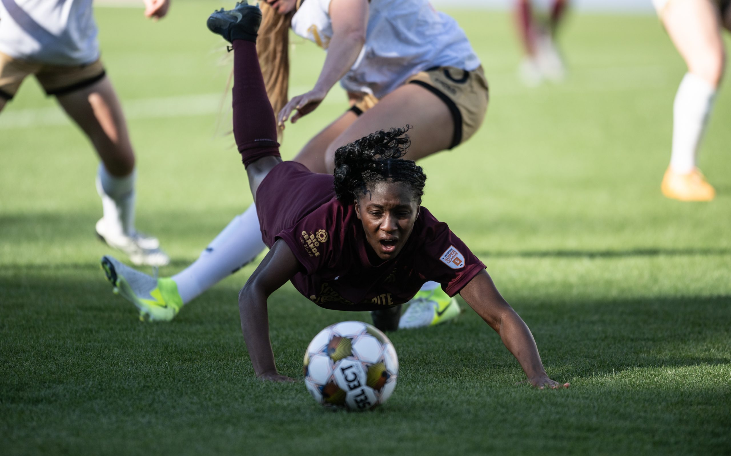 Samar Guidry dives headfirst into the action against Spokane Zephyr, April 4, 2025. (Mike Brooks, 3rd Degree)