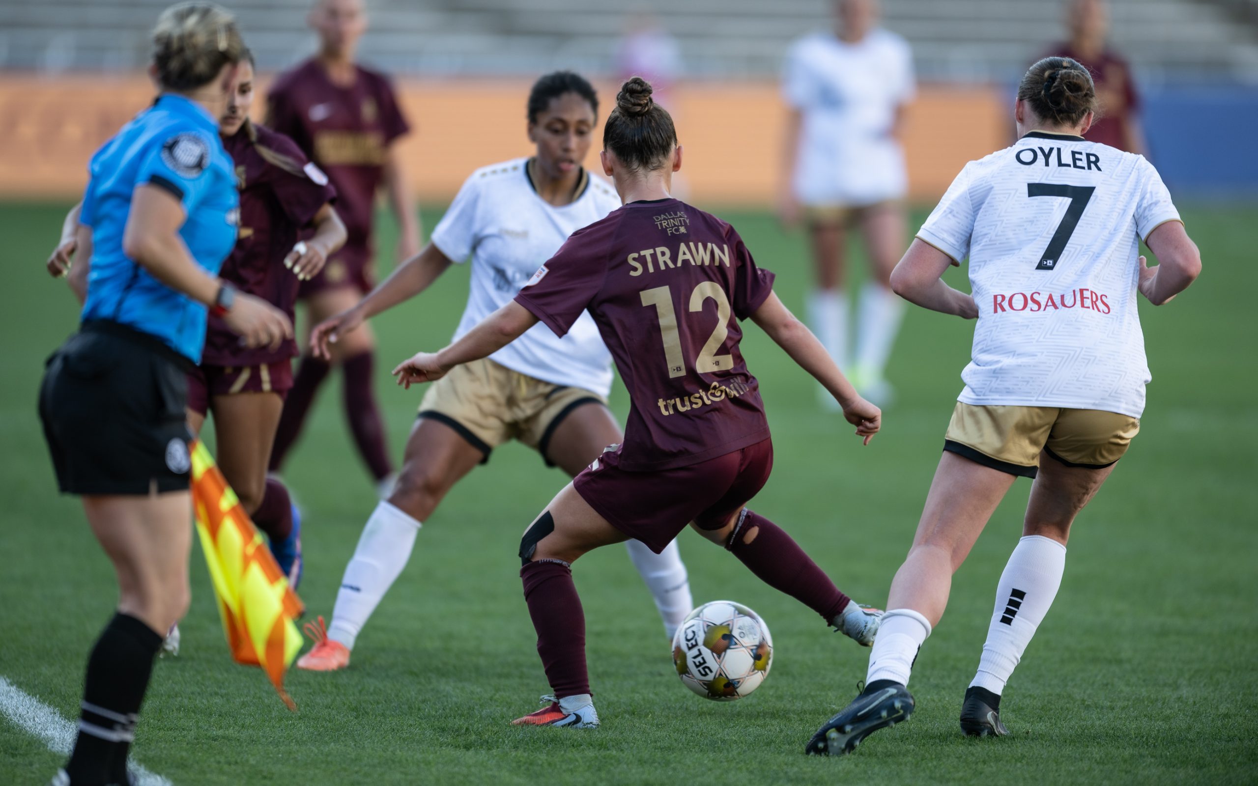 Sealey Strawn is surrounded by Spokane Zephyr, April 4, 2025. (Mike Brooks, 3rd Degree)