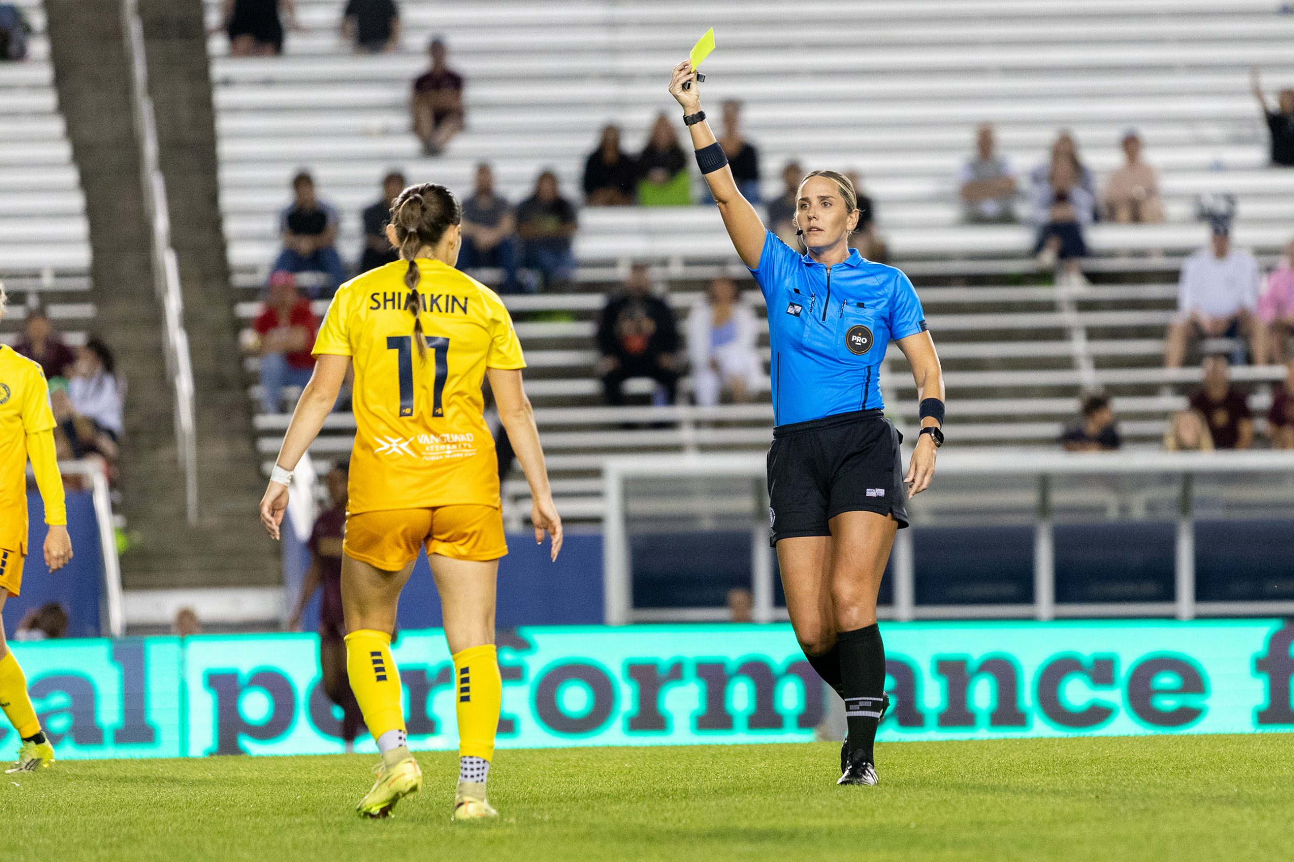 Referee Shawn Tehini gives a yellow card to Jillian Shimkin in the Dallas Trinity game against Tampa Bay Sun, March 31, 2026. (Beth Spicer, 3rd Degree)