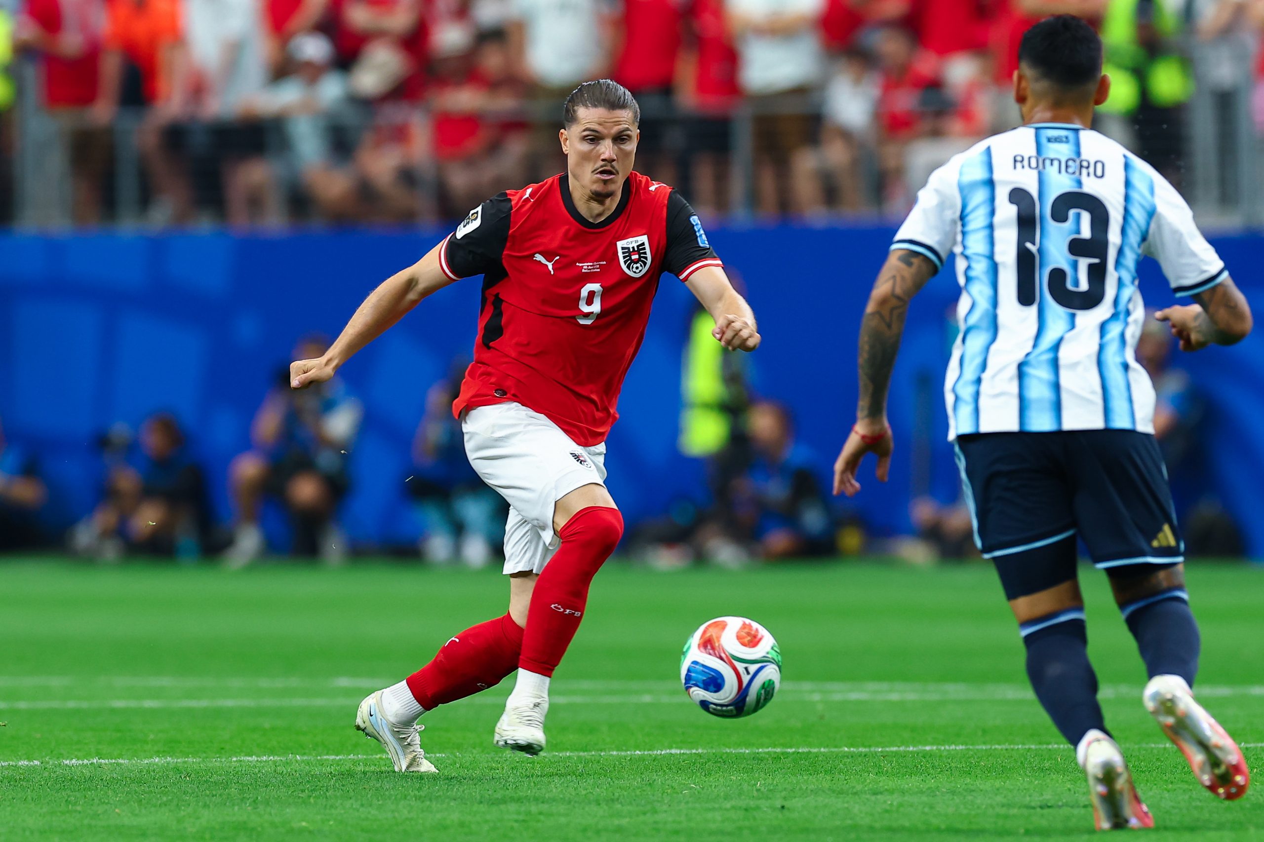 Marcel Sabitzer (9) prepares to take on Cristian Romero (13). Argentina vs Austria, World Cup 2026, June 22, 2026. (Matt Visinsky, 3rd Degree)