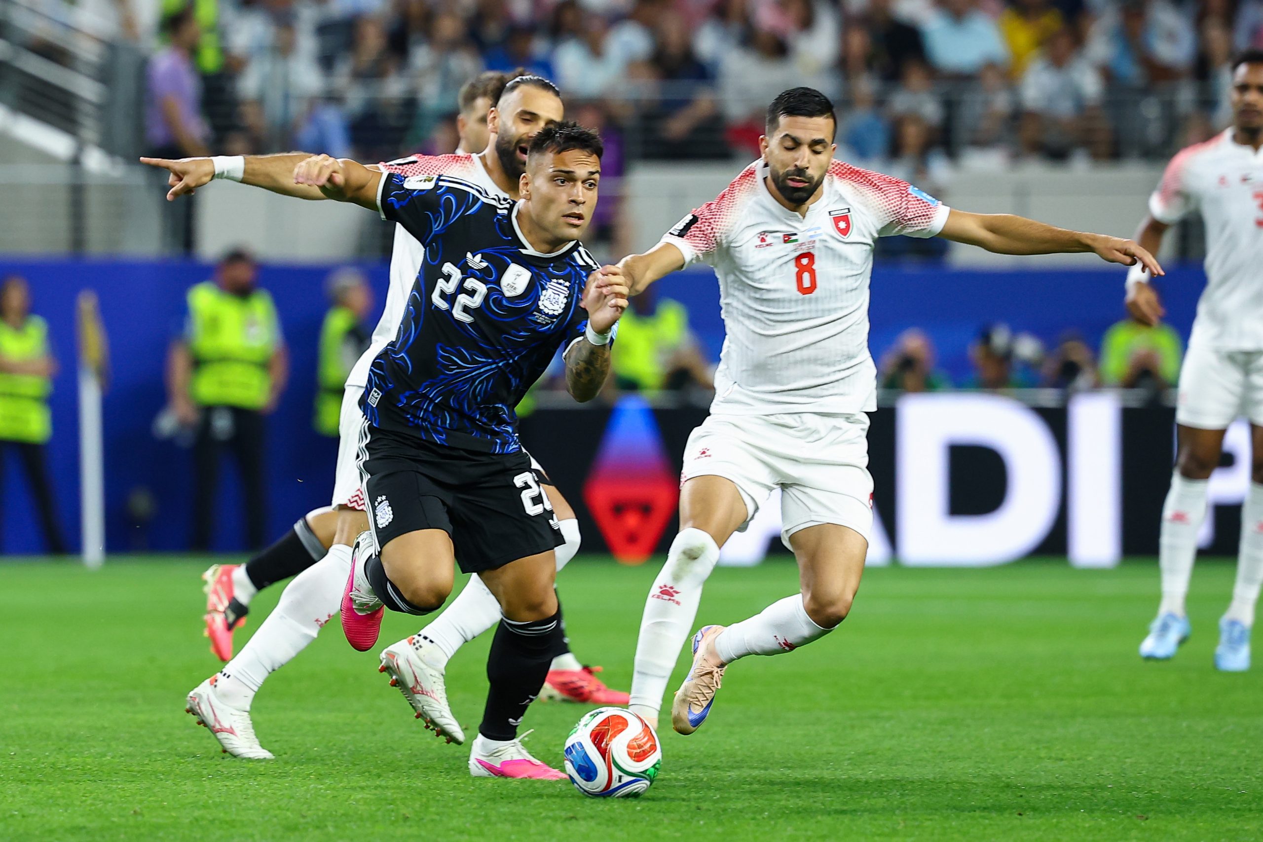 Lautaro Martínez (22) tries to get away from Noor Al-Rawabdeh (8). Jordan vs Argentina, 2026 World Cup, Dallas Stadium, June 27, 2026. (Matt Visinsky, 3rd Degree)