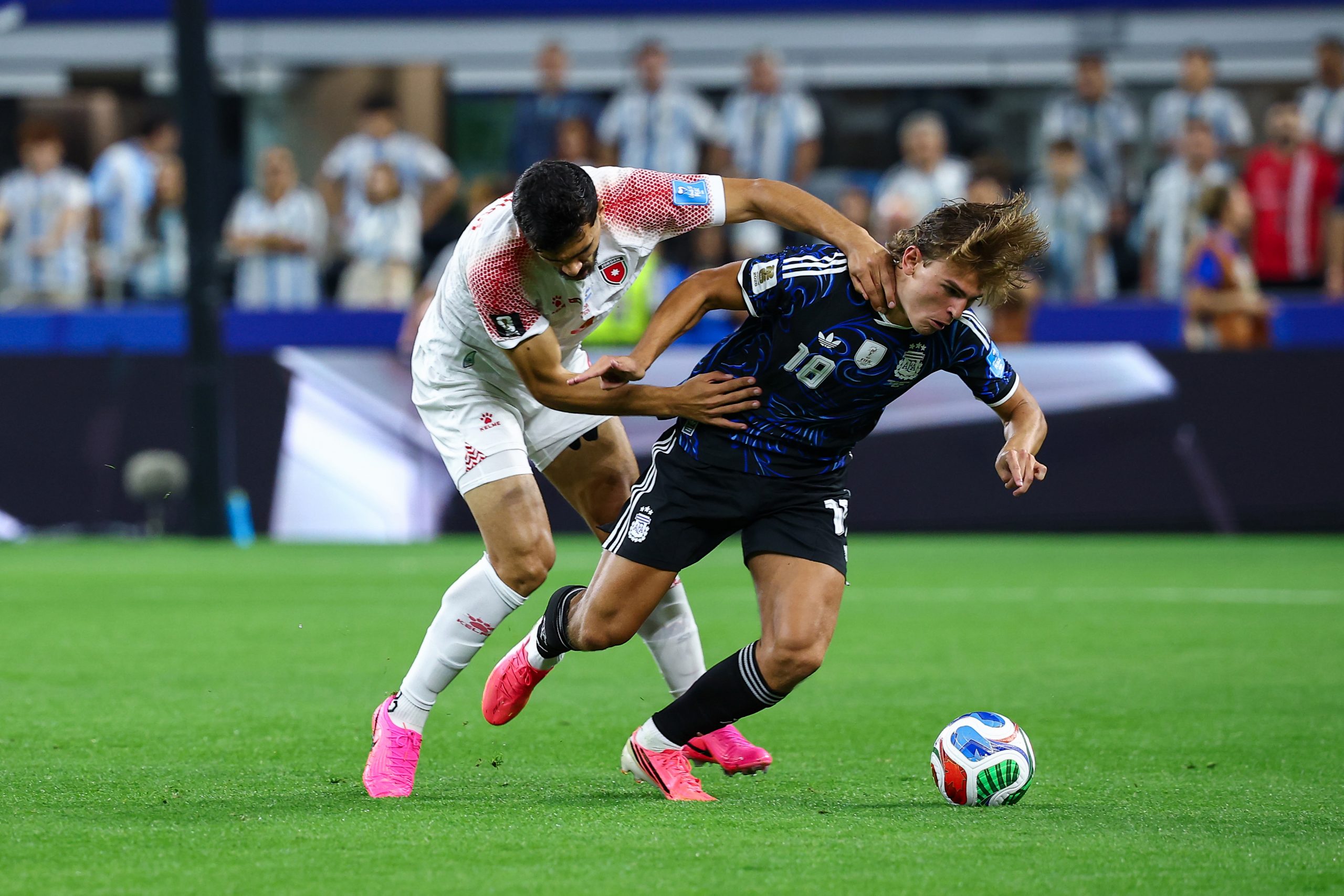Nico Paz (18) attempts to evade a defenders grasp. Jordan vs Argentina, 2026 World Cup, Dallas Stadium, June 27, 2026. (Matt Visinsky, 3rd Degree)