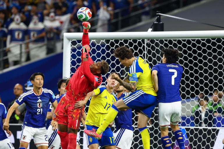 Zion Suzuki (1) punches the ball safely away. Japan vs Sweden, 2026 World Cup at Dallas Stadium, June 25, 2026. (Matt Visinsky, 3rd Degree)