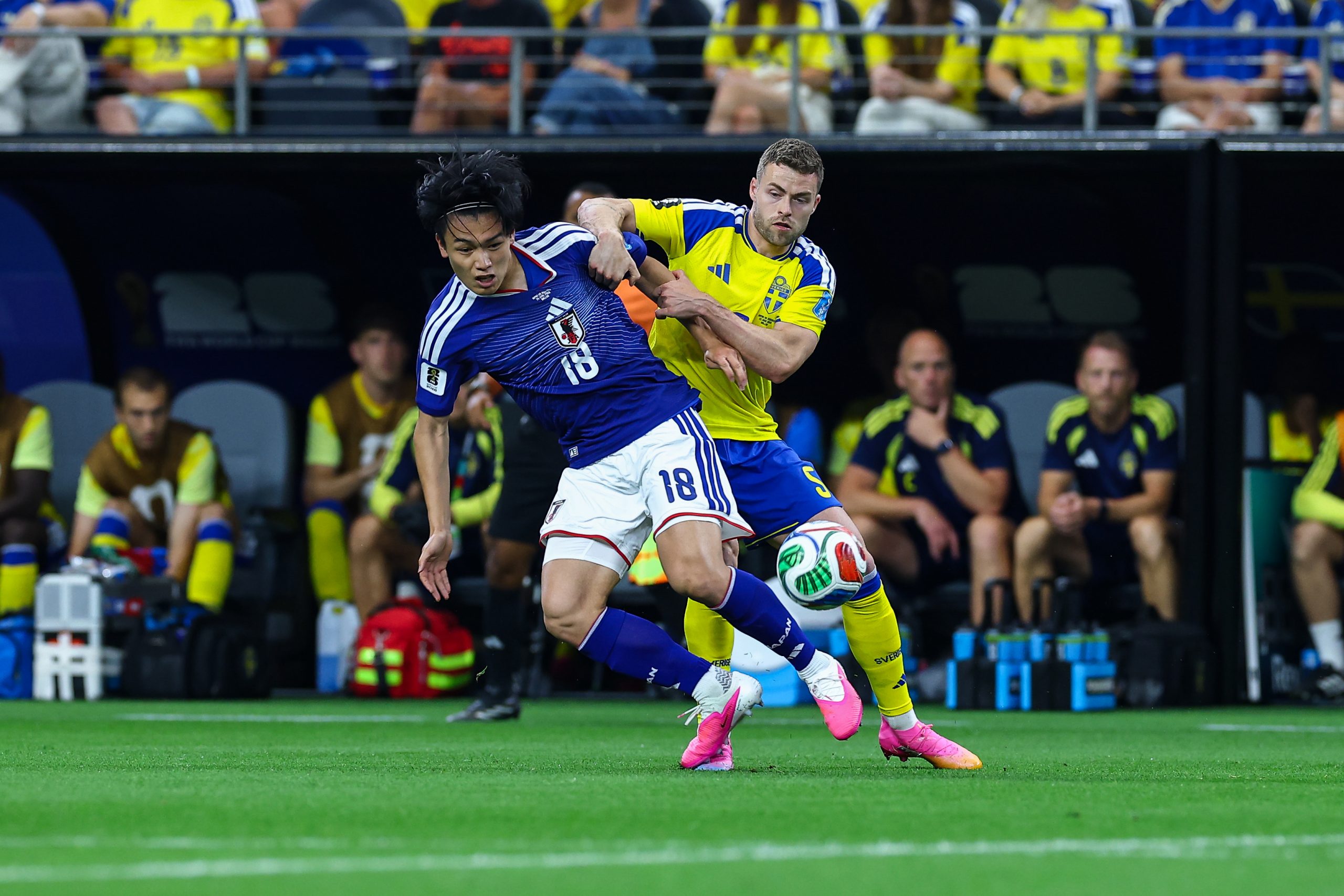 Ayase Ueda (18) fights off Gabriel Gudmundsson (5). Japan vs Sweden, 2026 World Cup at Dallas Stadium, June 25, 2026. (Matt Visinsky, 3rd Degree)