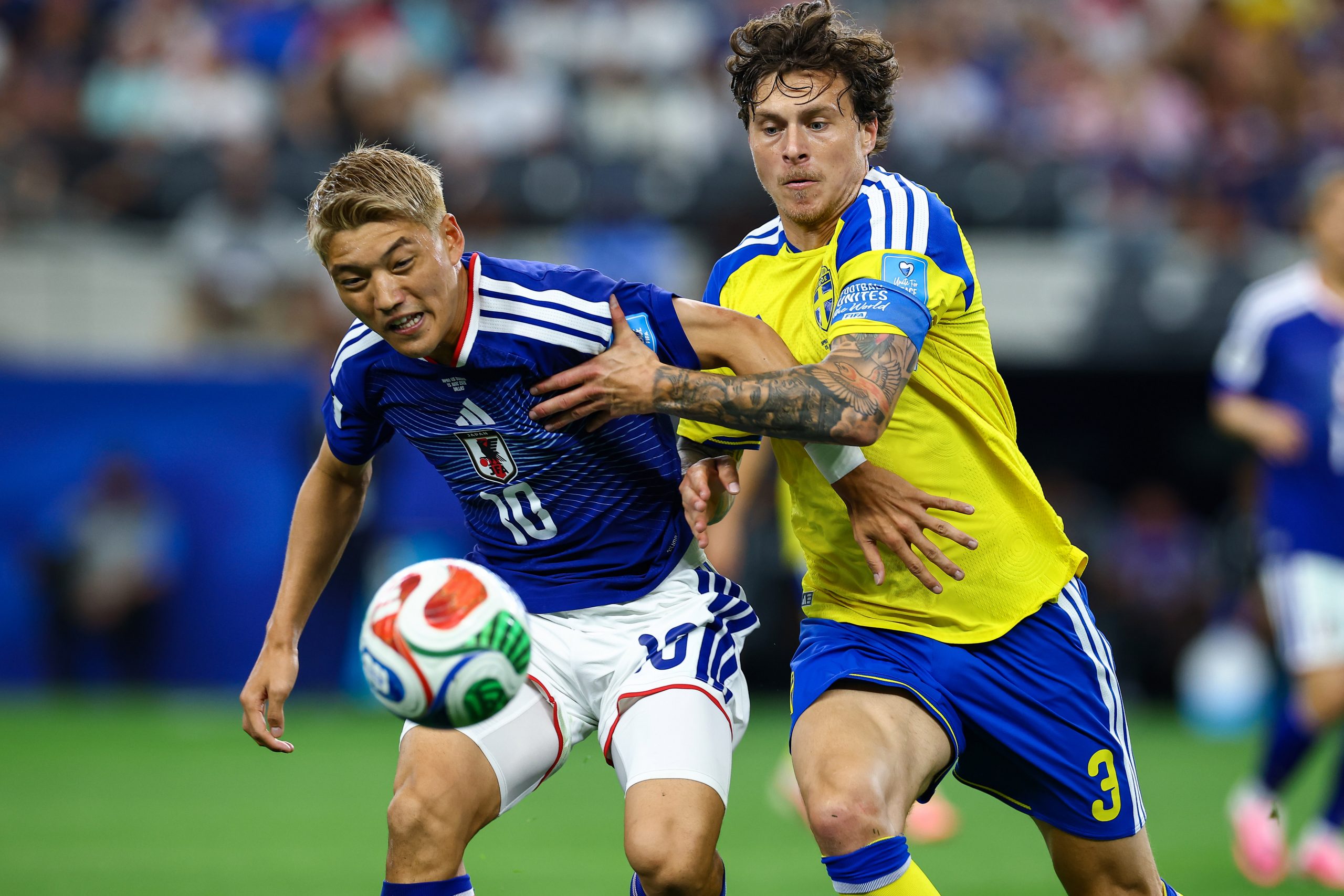 Ritsu Dōan (10) fights for the ball with Victor Lindelöf (3). Japan vs Sweden, 2026 World Cup at Dallas Stadium, June 25, 2026. (Matt Visinsky, 3rd Degree)