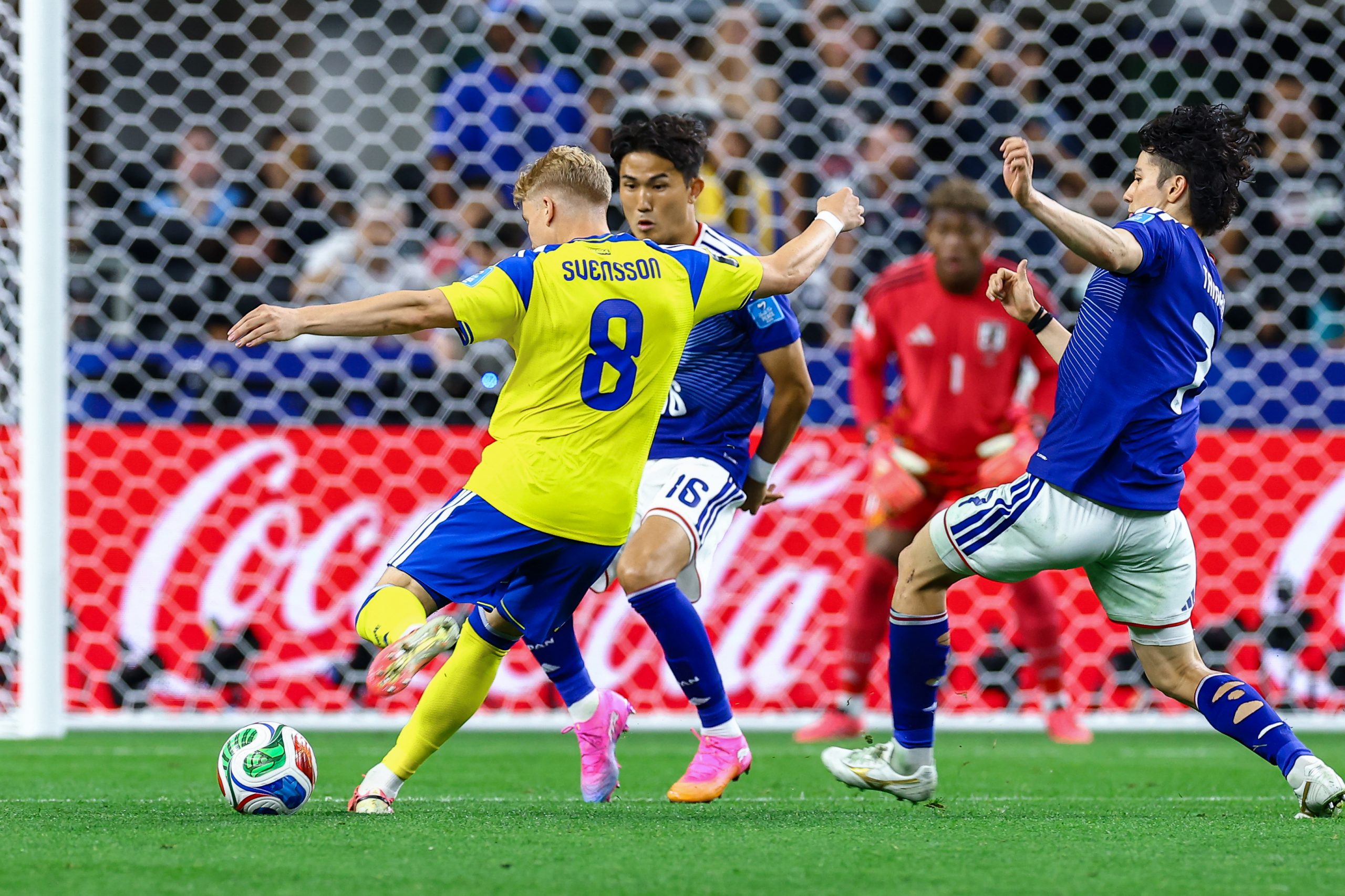 Daniel Svensson (8) tries to shoot around two defenders. Japan vs Sweden, 2026 World Cup at Dallas Stadium, June 25, 2026. (Matt Visinsky, 3rd Degree)