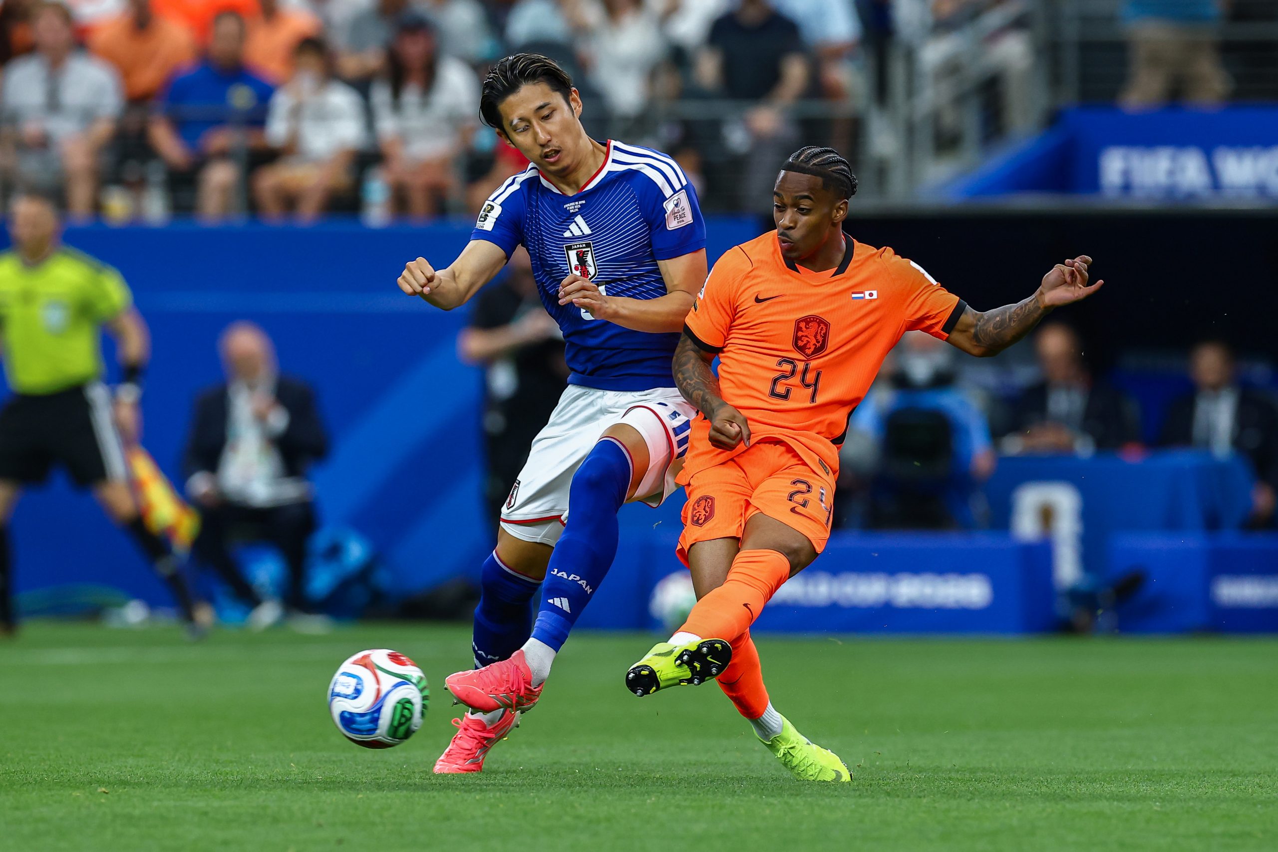 Crysencio Summerville (24) battles Hiroki Ito (21). Japan vs Netherlands, at "Dallas Stadium," 2026 World Cup, June 14, 2026. (Matt Visinsky, 3rd Degree)