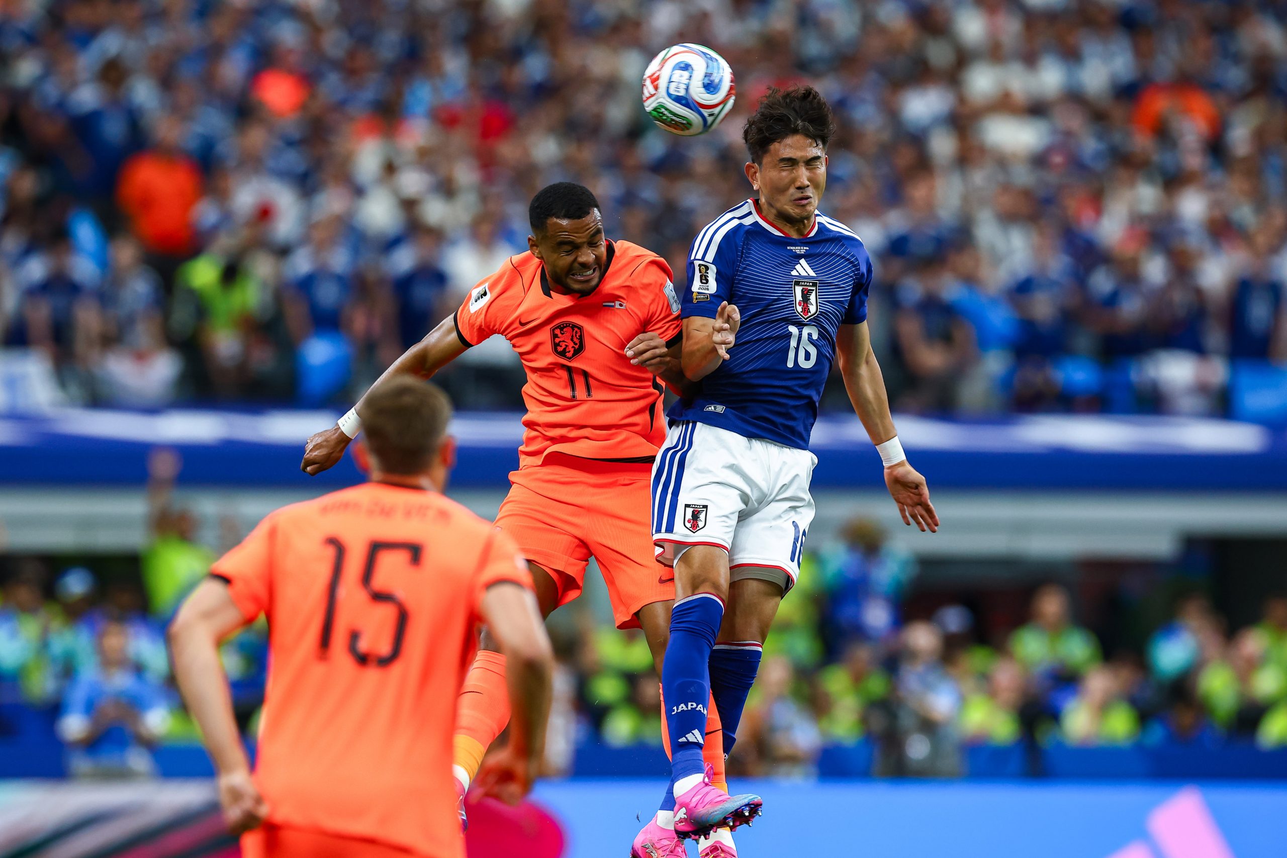 Cody Gakpo (11) and Tsuyoshi Watanabe (16) do battle. Japan vs Netherlands, at "Dallas Stadium," 2026 World Cup, June 14, 2026. (Matt Visinsky, 3rd Degree)