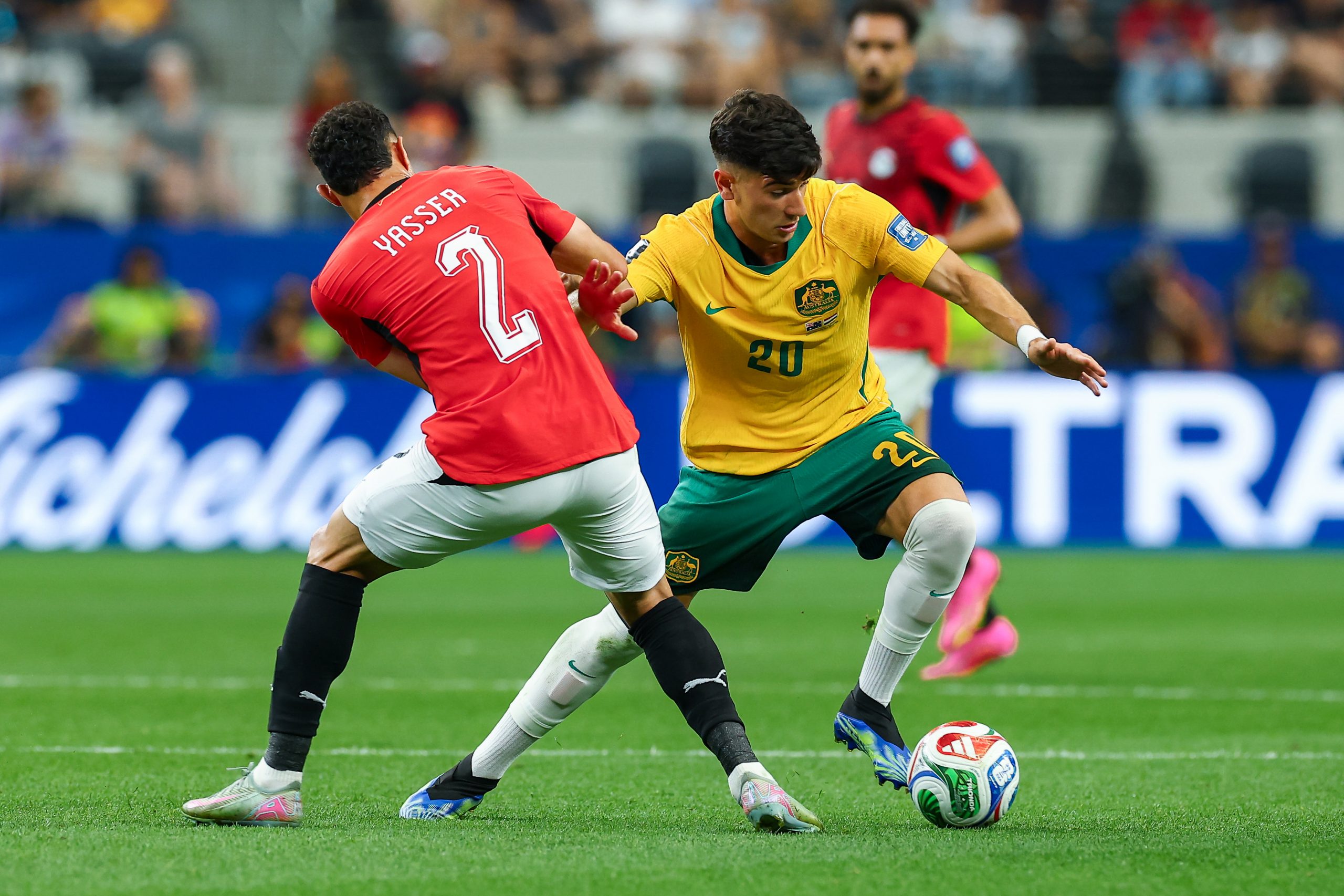 Cristian Volpato (20) cuts around Yasser Ibrahim (2). Australia vs Egypt, 2026 World Cup, Dallas Stadium, June 27, 2026. (Matt Visinsky, 3rd Degree)