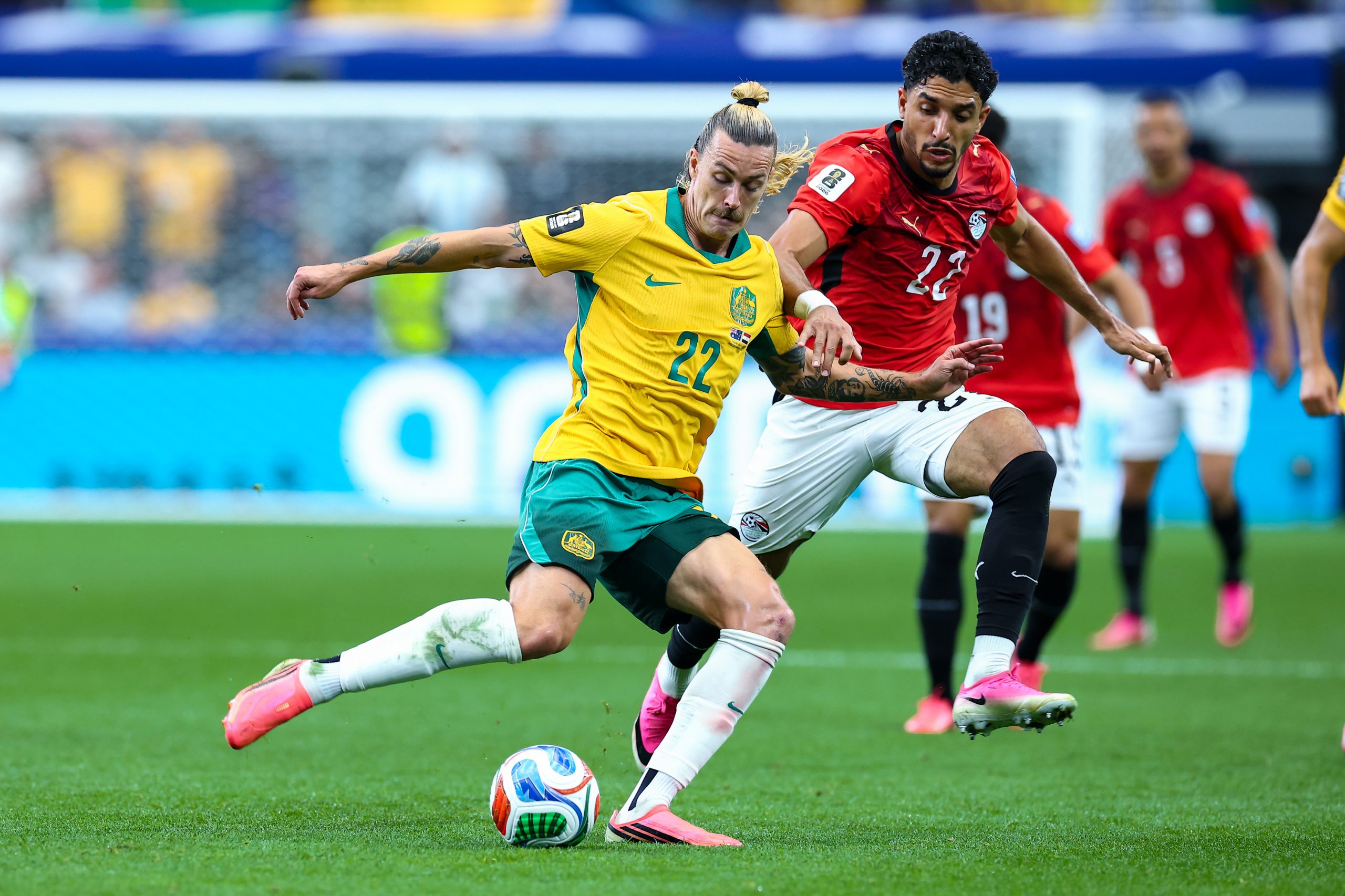 Double, double-deuce. Jackson Irvine (22) on the ball against Omar Marmoush (22). Australia vs Egypt, 2026 World Cup, Dallas Stadium, June 27, 2026. (Matt Visinsky, 3rd Degree)