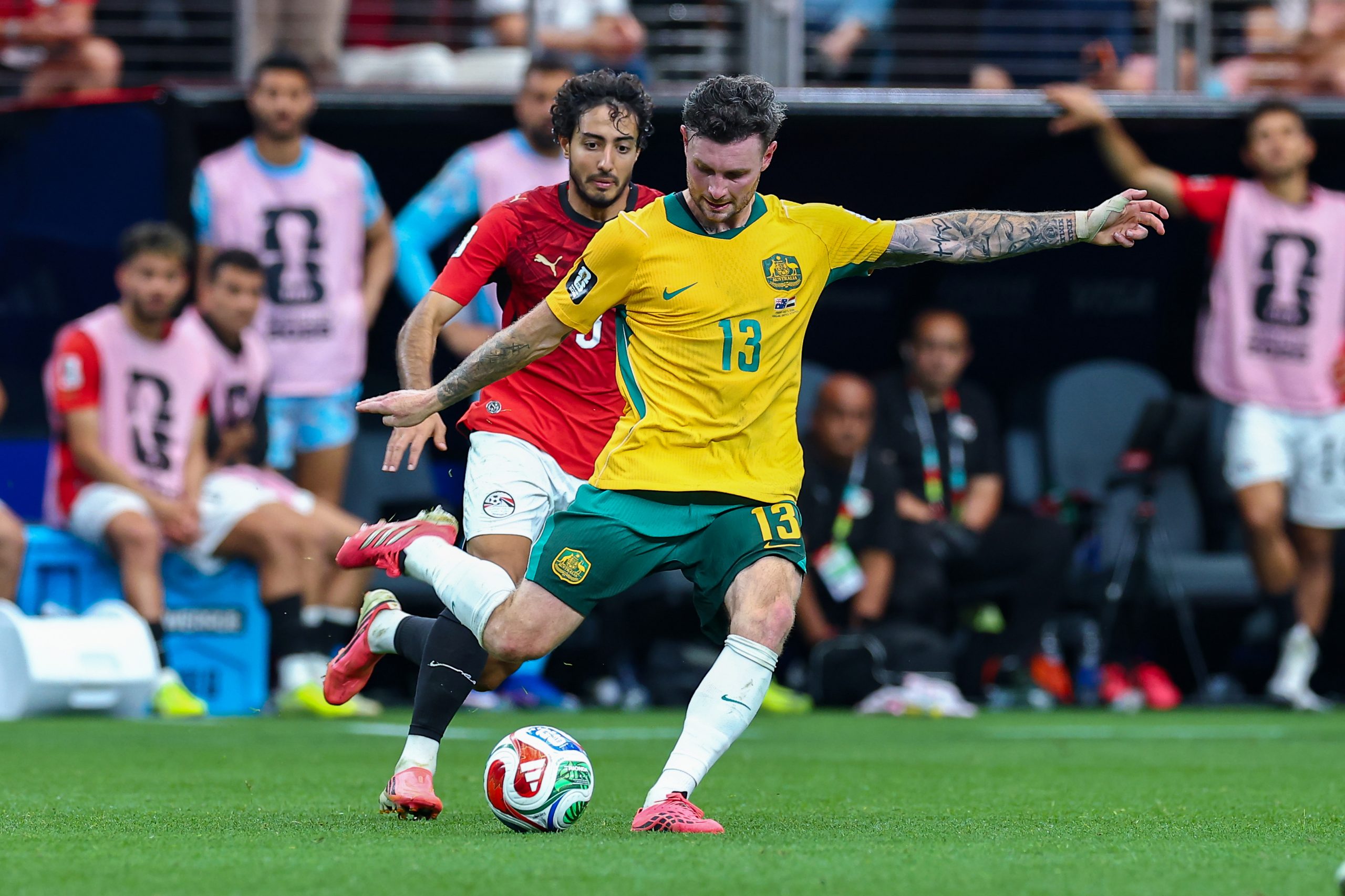 Aiden O'Neill (13) shoots with Mohamed Hany (3) in pursuit. Australia vs Egypt, 2026 World Cup, Dallas Stadium, June 27, 2026. (Matt Visinsky, 3rd Degree)