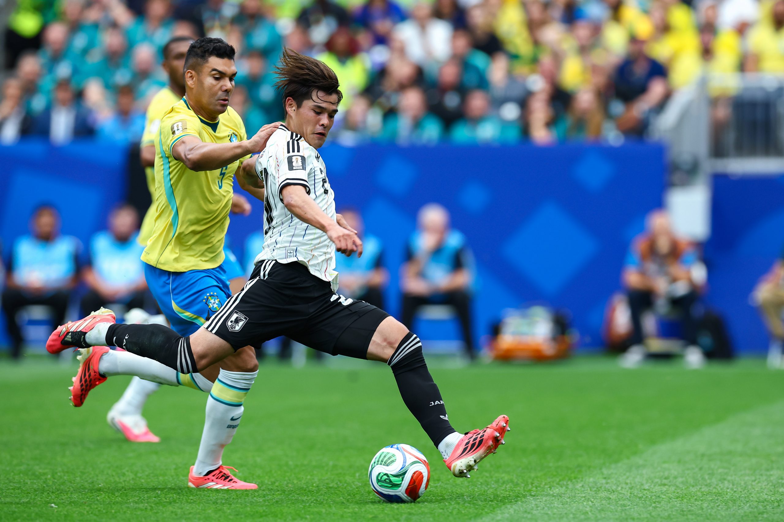 Kaishū Sano (24) takes a shot while under pressure from Casemiro (5). Japan vs Brazil, 2026 World Cup, Dallas Stadium, June 27, 2026. (Matt Visinsky, 3rd Degree)